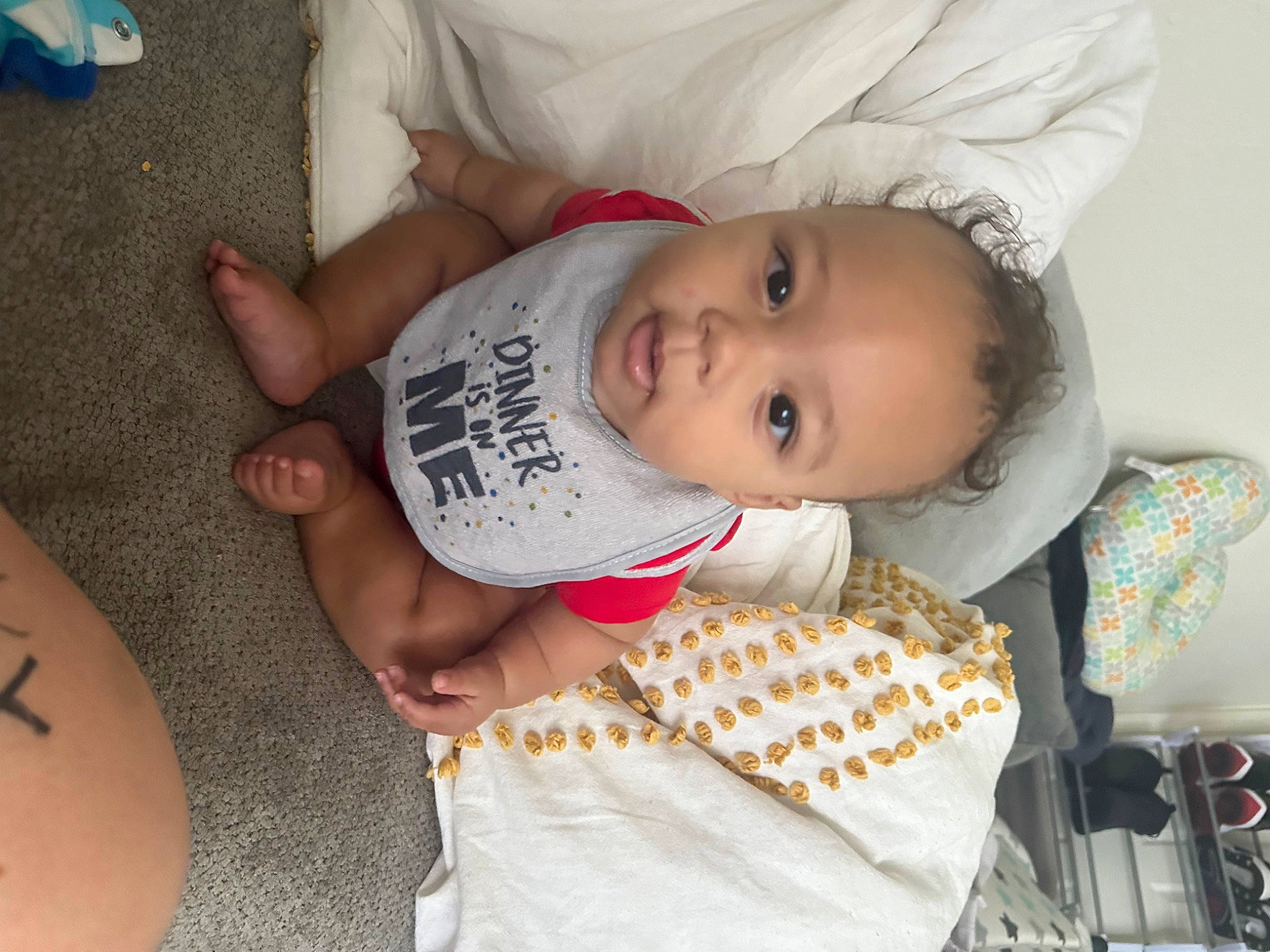 Zyiere is registered to the contest to win money with this photo: arm, baby, baby_toddler_clothing, cheek, child, comfort, elbow, foot, hand, happy, human_leg, mouth, nail, organ, person, skin, sleeve, temporary_tattoo, thigh, toddler