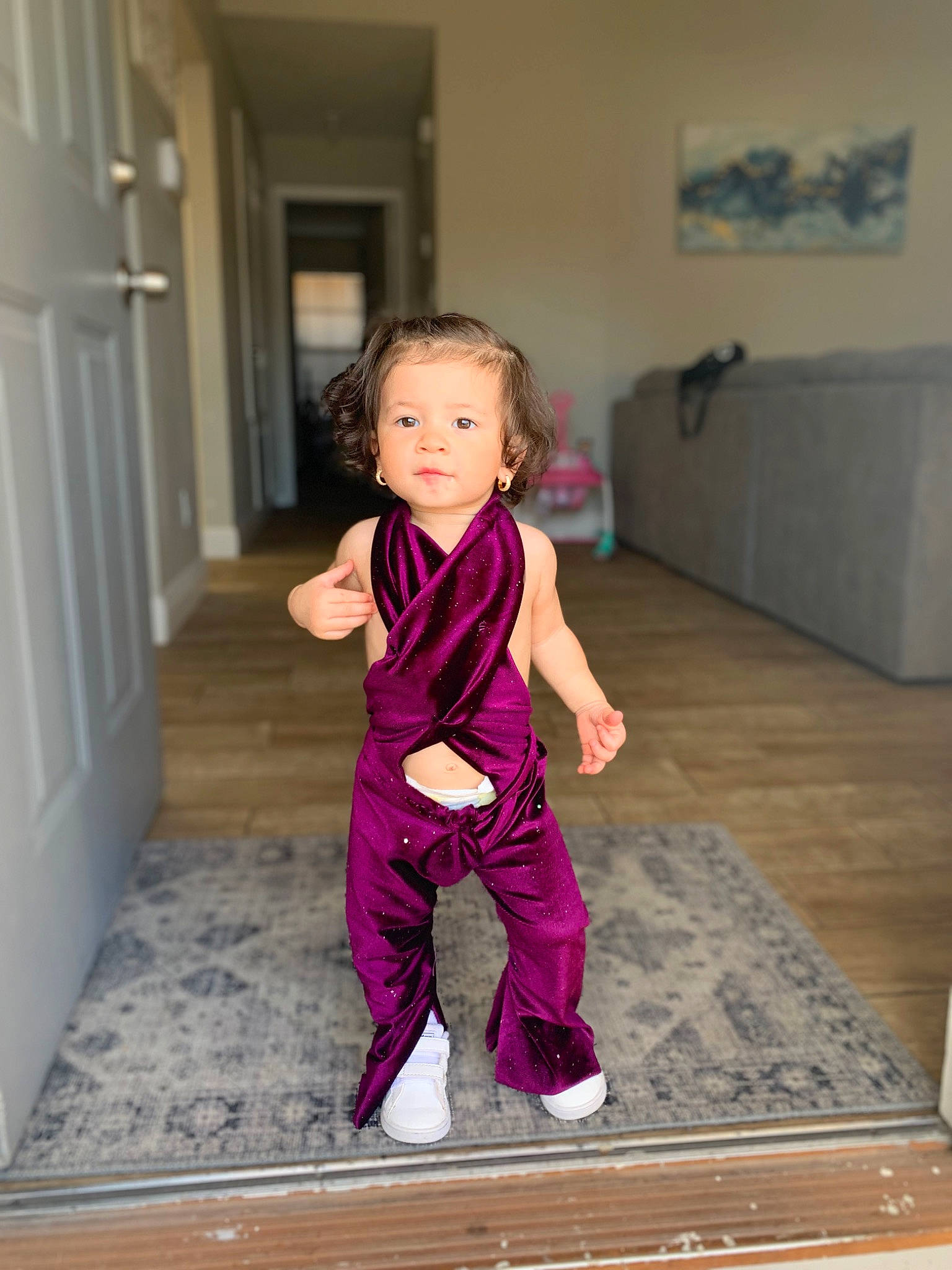 Julissa is registered to the contest to win money with this photo: active_pants, baby_toddler_clothing, clothing, door, dress, face, floor, flooring, hardwood, leg, magenta, person, pink, purple, sleeve, sportswear, suit, sweatpant, toddler, waist