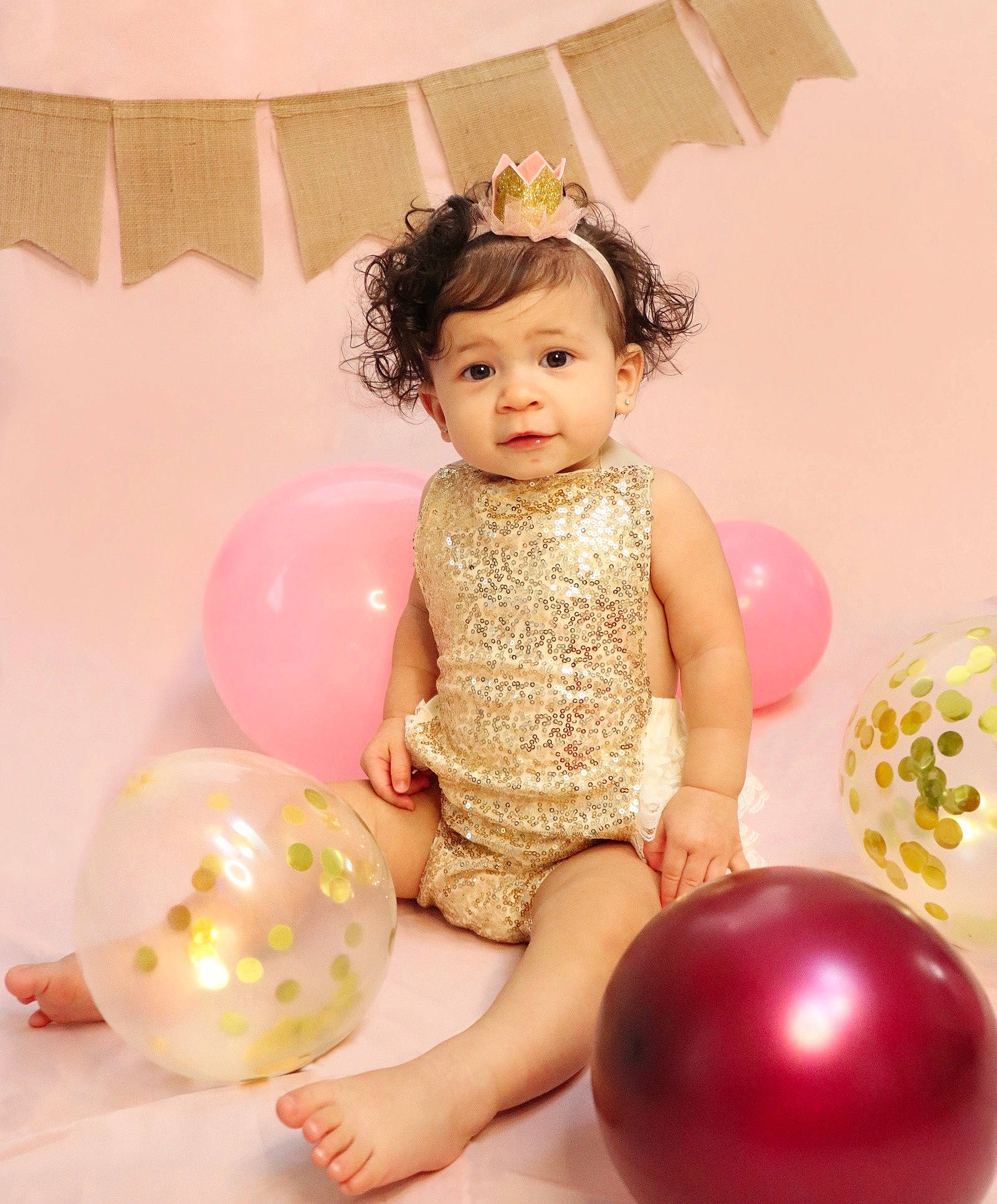Julissa is registered to the contest to win money with this photo: baby_toddler_clothing, balloon, child, dress, facial_expression, finger, fun, happy, head, lighting, magenta, organ, party_supply, person, pink, product, skin, thigh, toddler, toy