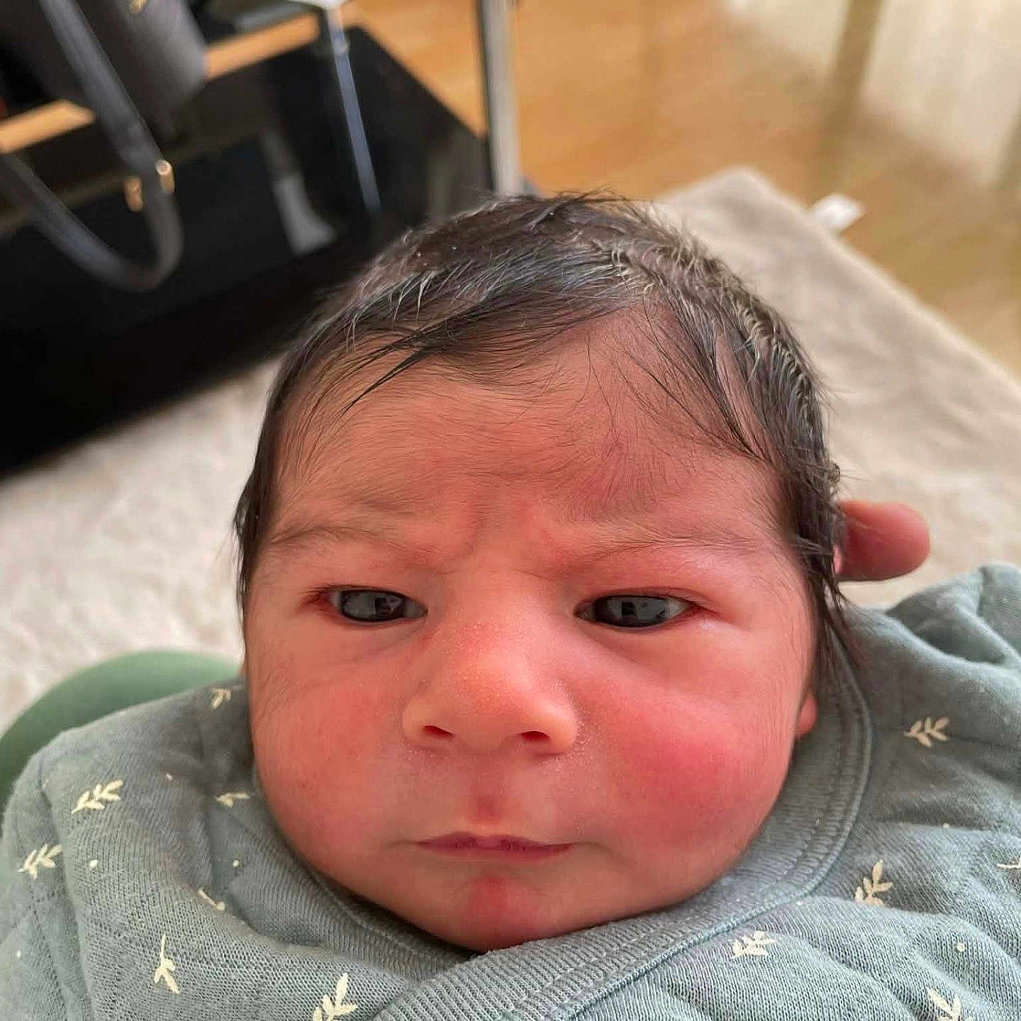 Gaya-Iliane participe au concours pour gagner de l'argent avec cette photo : newborn, baby, infant, face, expression, blanket, clothing, indoor, person, portrait, head, skin, hair, closeup, wrapped, cute, young, child, cozy, soft