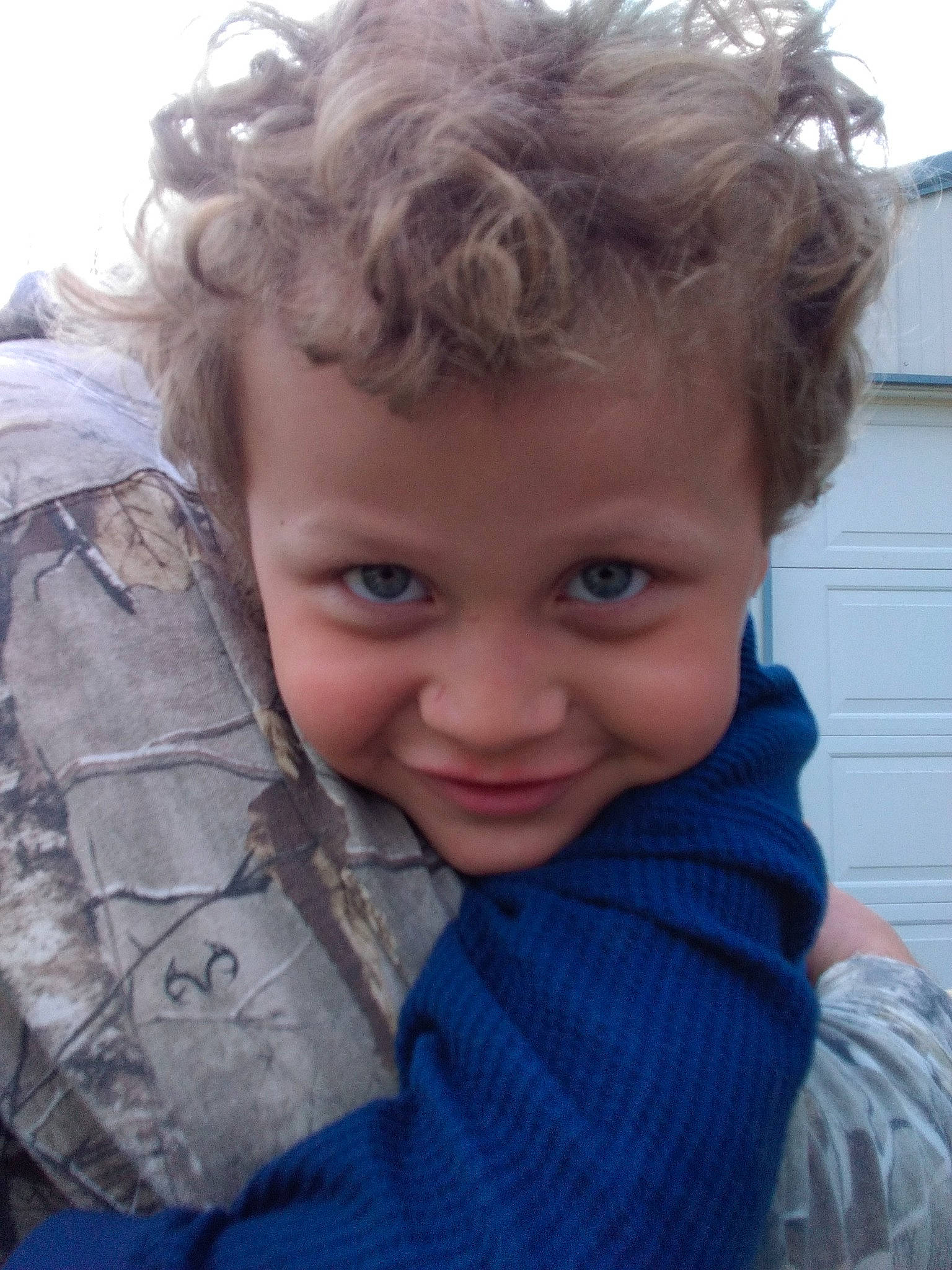 Jordan is registered to the contest to win money with this photo: blond, chin, cool, electric_blue, eye, flash_photography, forehead, fun, grass, hairstyle, happy, iris, joy, lip, nose, outerwear, person, skin, smile, surfer_hair