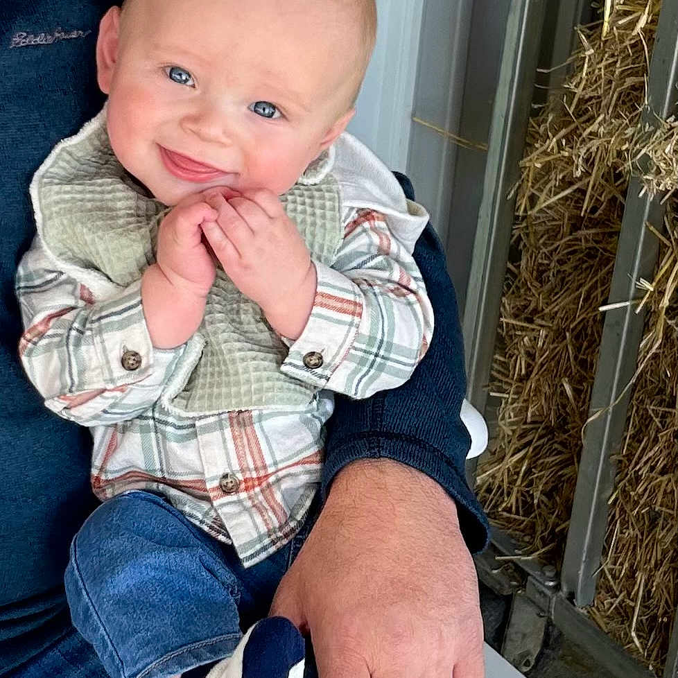 Landyn joined the competition — help win amazing prizes! baby, clothing, coat, countryside, face, footwear, happy, head, hosiery, jacket, jeans, nature, outdoors, pants, person, photography, portrait, shoe, sitting, sock