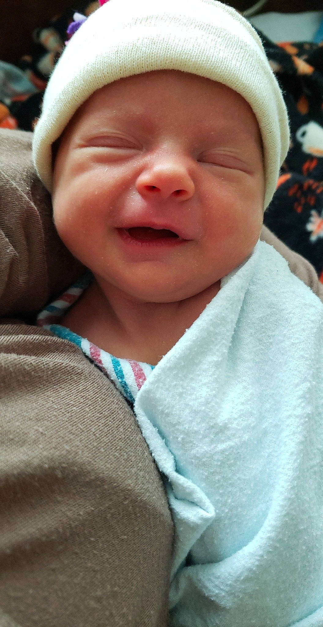 Evelyn joined the competition — help win amazing prizes! baby, cap, cheek, child, close_up, eye, facial_expression, grass, happy, hat, headgear, headwear, lip, mouth, nose, outerwear, person, pink, skin, sleeve