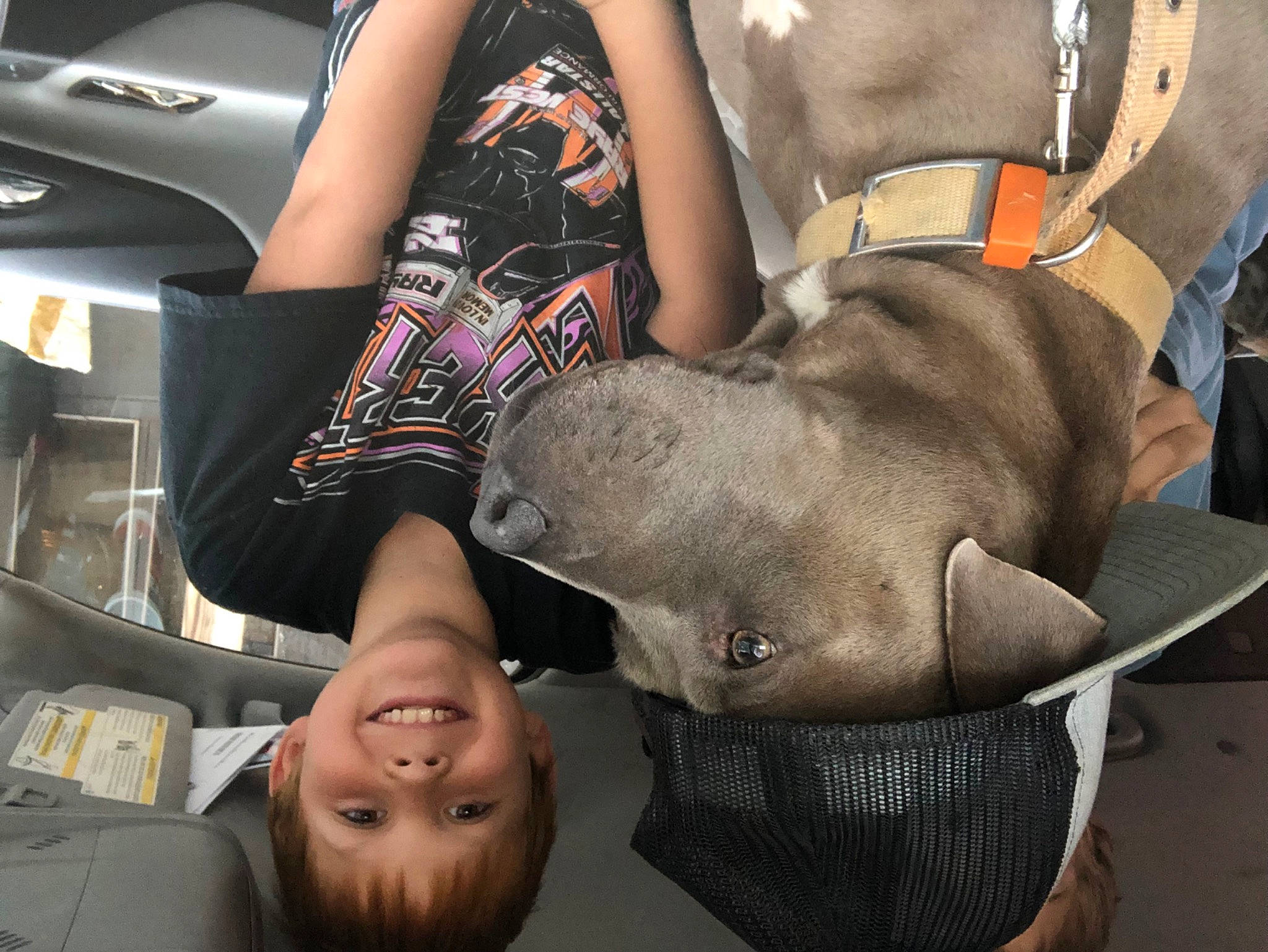 Matthew is registered to the contest to win money with this photo: abdomen, automotive_design, automotive_exterior, bag, chest, eyewear, family_car, fashion_accessory, gesture, human_leg, joy, luxury_vehicle, motor_vehicle, nail, person, personal_luxury_car, smile, sunglasses, thigh, trunk