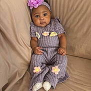 Dream joined the competition — help win amazing prizes! baby, beige_background, casual, child, comfortable, couch, cozy_clothing, curious_expression, cute, flower_decor, flower_headband, headband, indoor, infant, portrait, purple_outfit, sitting, small_hands, soft_fabric, white_socks