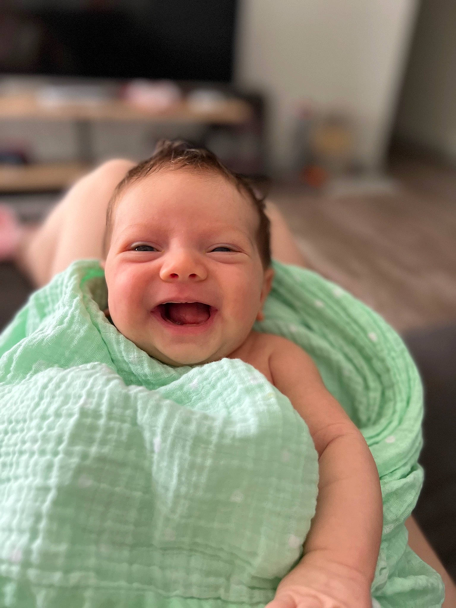 River is registered to the contest to win money with this photo: baby, baby_products, baby_toddler_clothing, cheek, chin, comfort, eye, face, fun, happy, head, human_body, iris, linens, mouth, nose, person, skin, smile, television