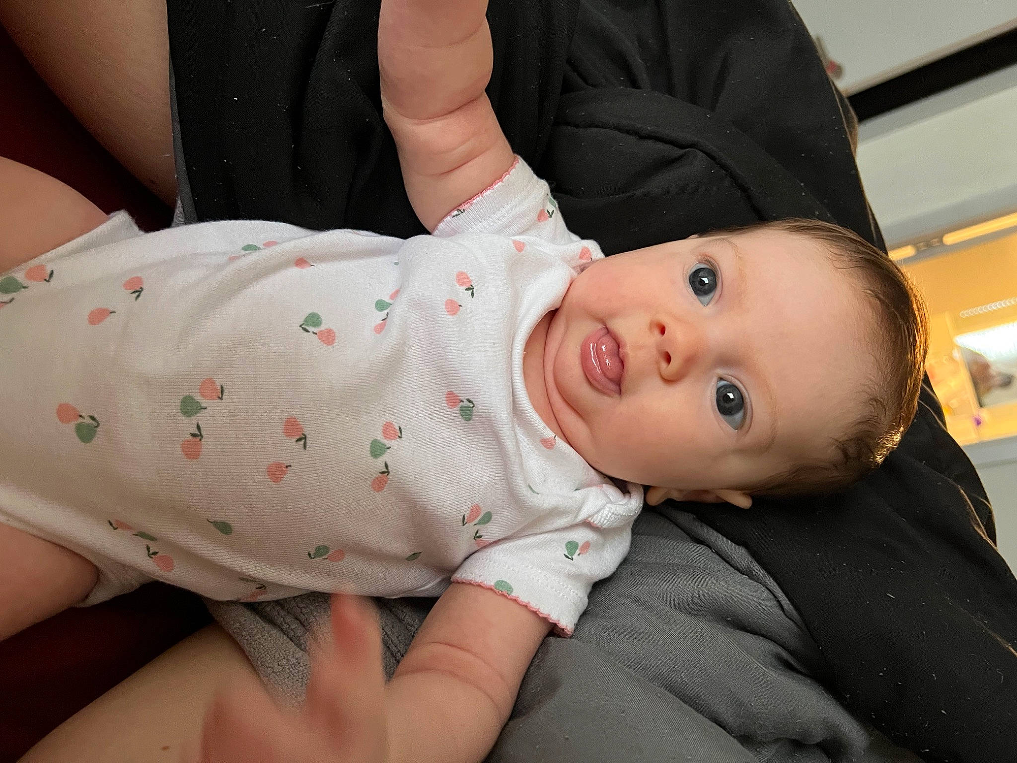 River is registered to the contest to win money with this photo: abdomen, baby, baby_toddler_clothing, cheek, child, collar, comfort, elbow, flash_photography, happy, hat, head, human_body, nose, pattern, person, sitting, skin, sleeve, smile