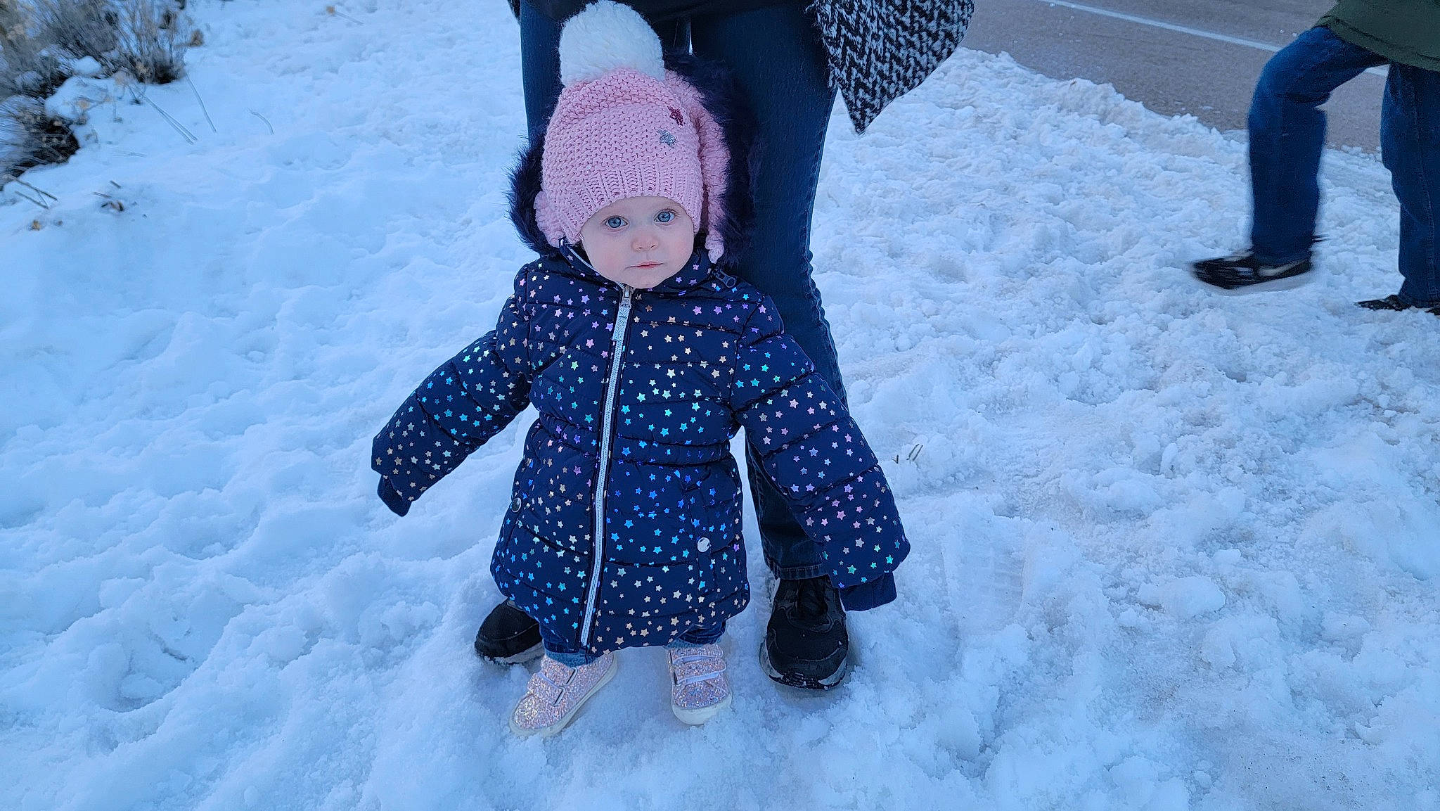 Enya is registered to the contest to win money with this photo: beanie, child, electric_blue, freezing, frost, fun, fur, headwear, jacket, knit_cap, outerwear, pattern, people, people_in_nature, person, playing_in_the_snow, precipitation, snow, toddler, tree