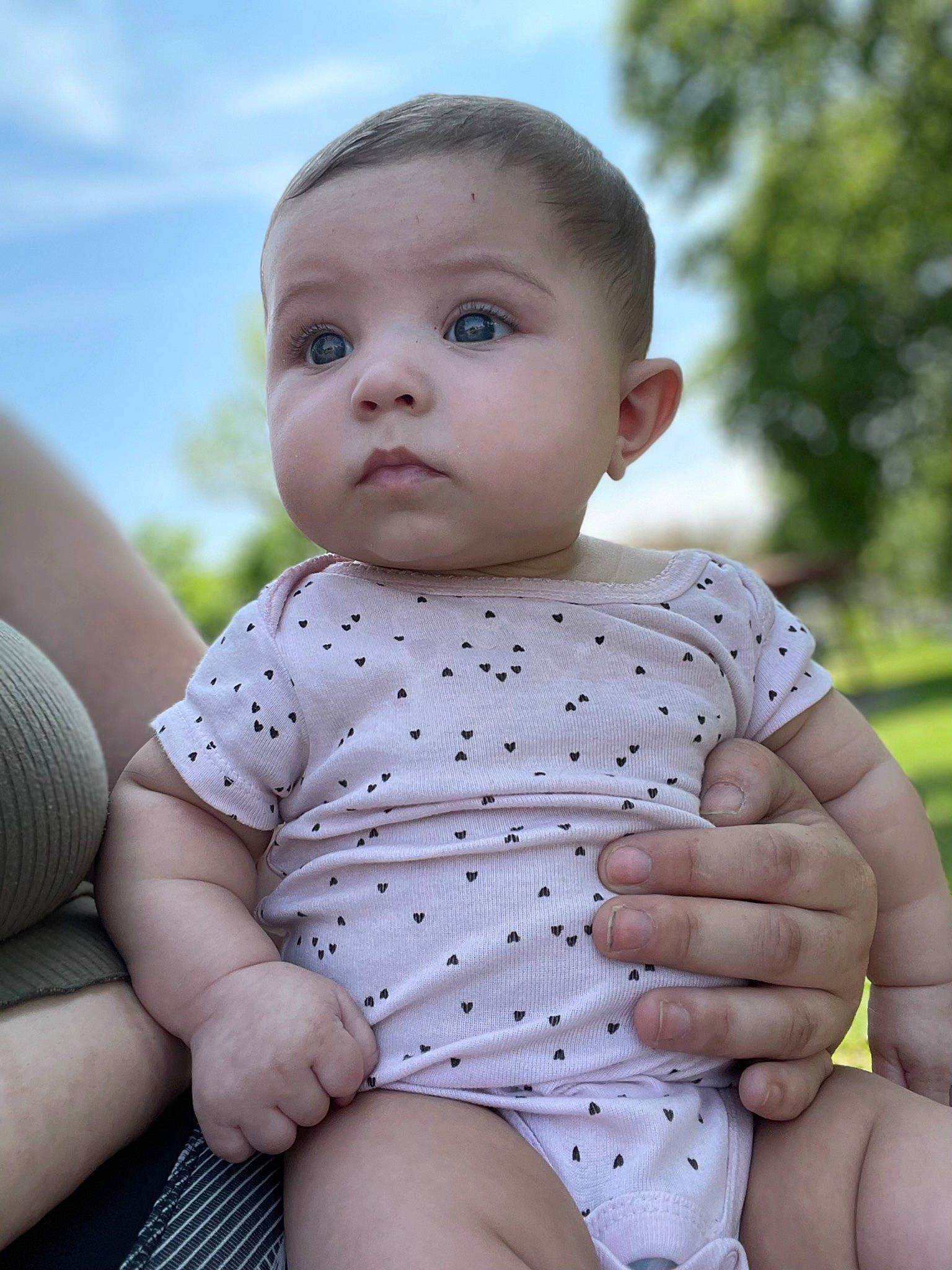 Sequoia is registered to the contest to win money with this photo: arm, baby, baby_toddler_clothing, cheek, cloud, eye, face, finger, grass, hand, happy, iris, lip, person, skin, sky, sleeve, standing, stomach, thigh