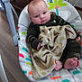 Shawn joined the competition — help win amazing prizes! baby, blanket, baby_rocker, infant, clothing, face, hands, feet, wood_floor, furniture, interior, person, cute, indoors, child, soft_toy_pattern, expression, seated, home, comfort