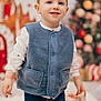 Lyam a rejoint le concours — aidez-le/la à gagner de superbes lots ! blue_vest, buttoned_vest, child, christmas_tree, cute, face, festive_background, fuzzy_texture, hands, happy, holiday, indoor, jeans, portrait, seasonal, smile, standing, toddler, white_shirt, wrapped_gifts