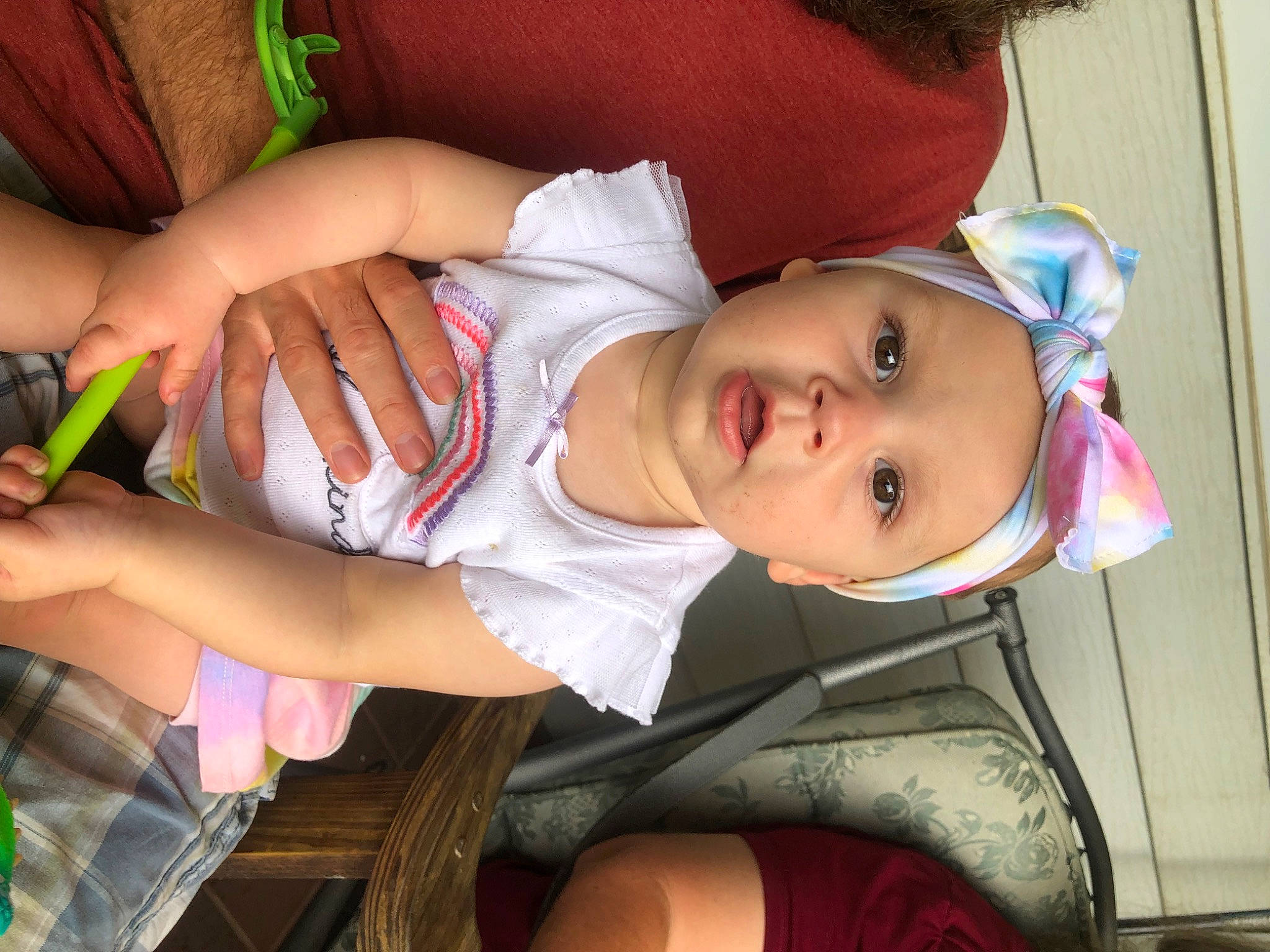 Emma is registered to the contest to win money with this photo: baby, baby_toddler_clothing, cheek, child, comfort, elbow, finger, fun, hand, happy, headwear, human_body, human_leg, lip, mouth, nail, person, skin, smile, surprise