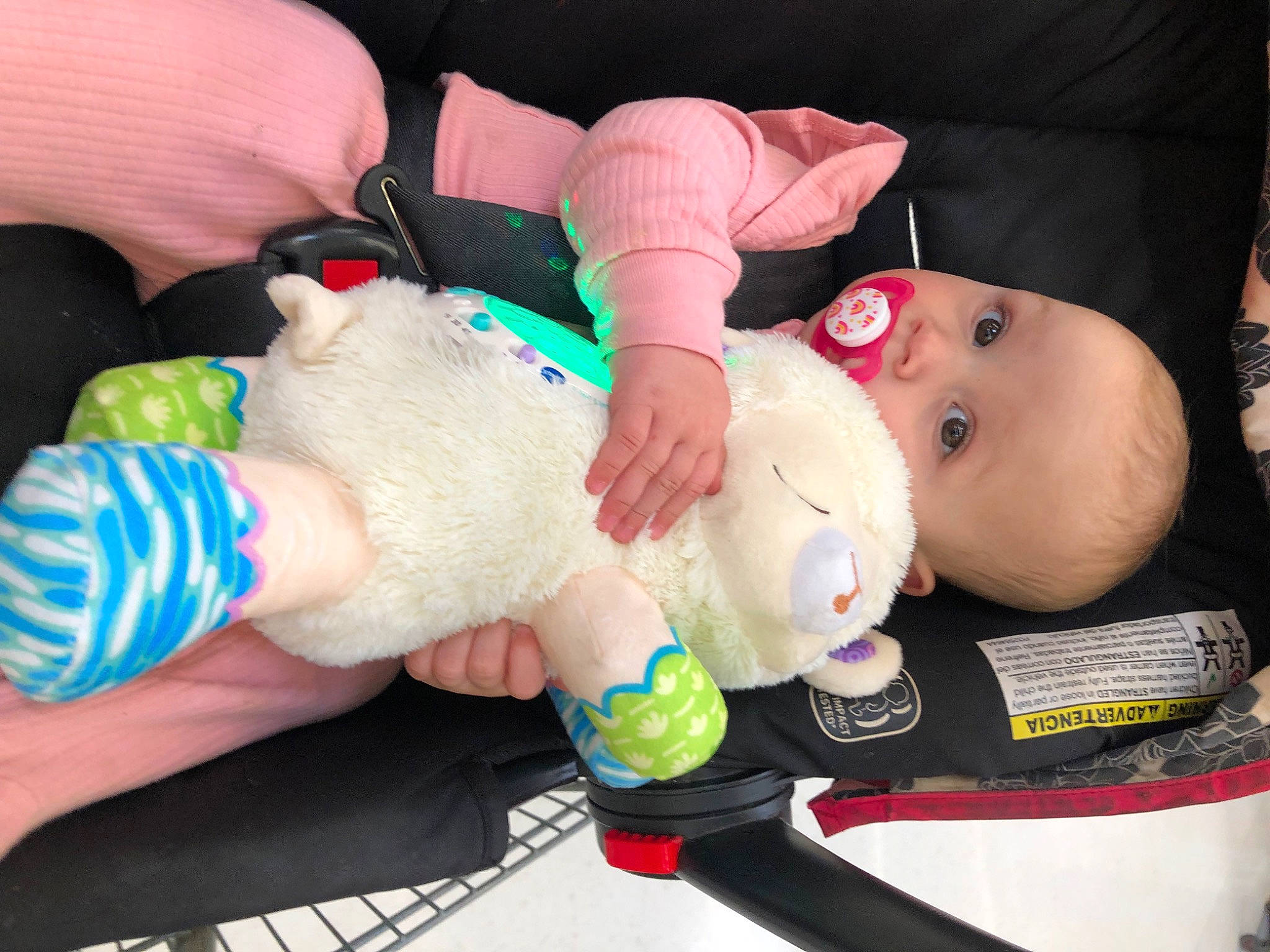 Emma is registered to the contest to win money with this photo: arm, baby, baby_products, cheek, child, comfort, eyelash, finger, gesture, hand, human_body, joint, mouth, nail, person, plastic_bottle, skin, thumb, toddler, toy