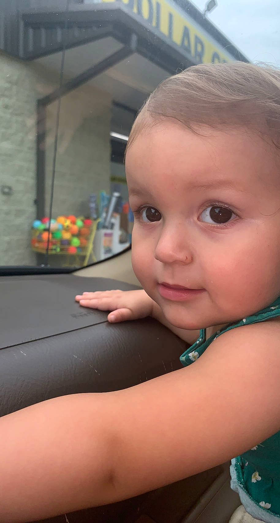 Baylee is registered to the contest to win money with this photo: baby, baby_toddler_clothing, cheek, chest, child, eyelash, fun, gesture, grass, happy, leisure, lip, mouth, nose, person, skin, smile, thumb, toddler, window