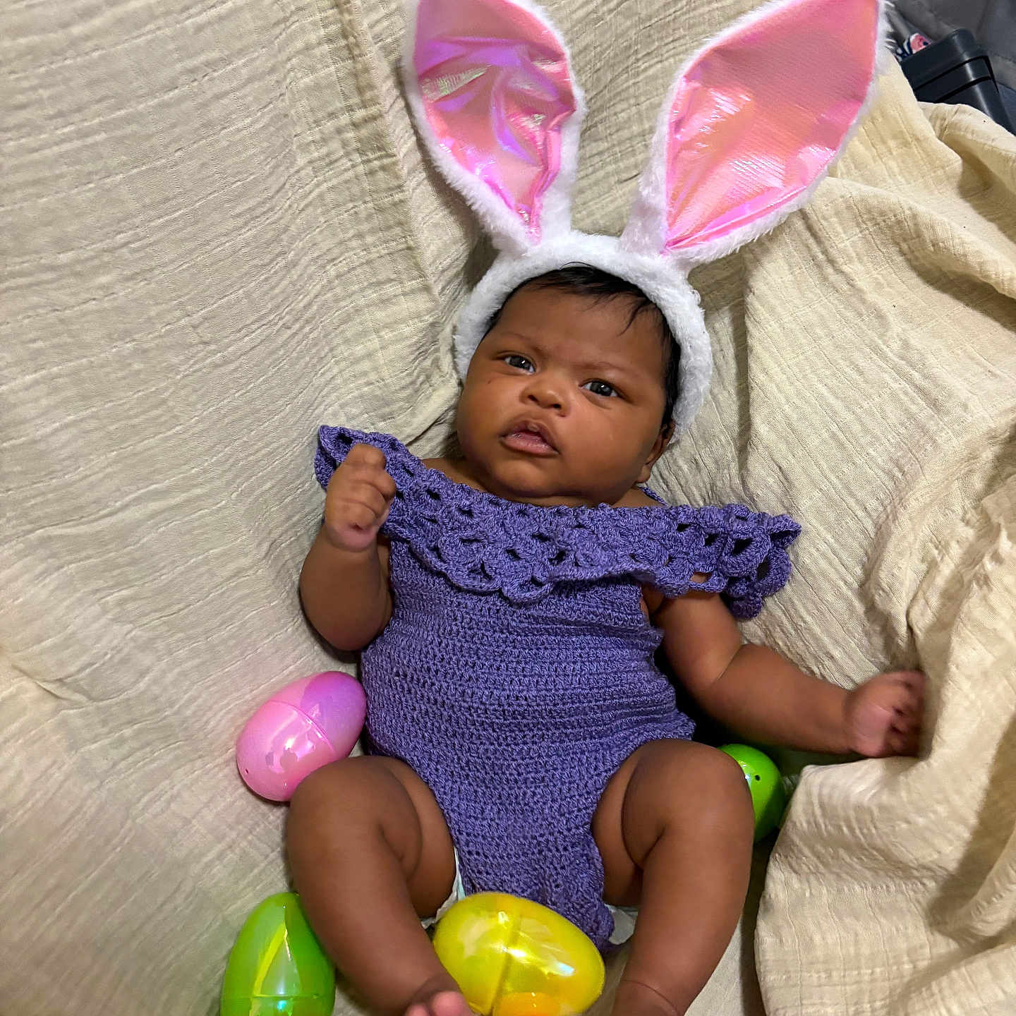 Isabella joined the competition — help win amazing prizes! adult, baby, balloon, bodypart, bonnet, cap, clothing, couch, face, female, finger, furniture, hand, hat, head, person, photography, portrait, purple, woman