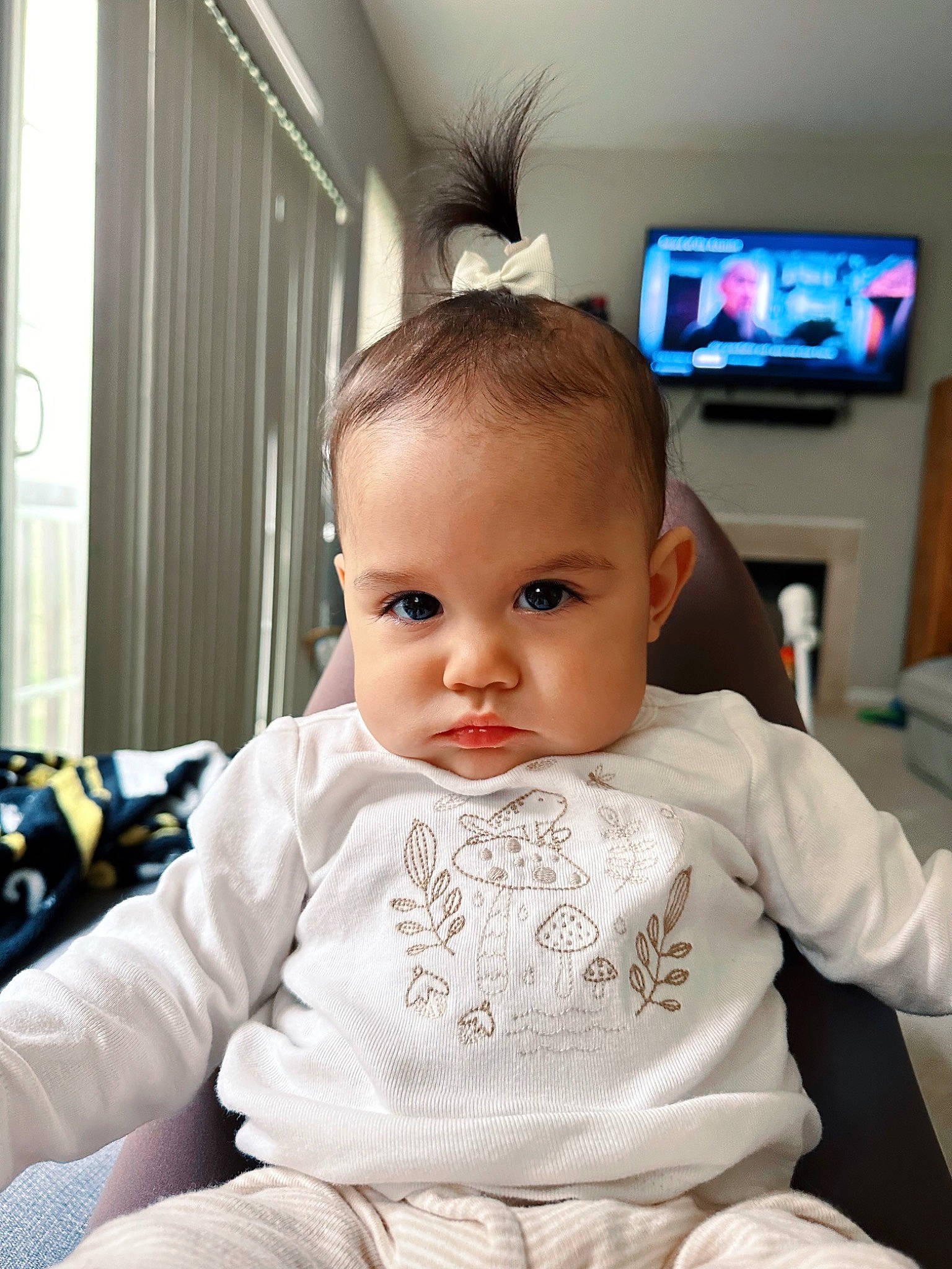 Emersyn joined the competition — help win amazing prizes! baby, baby_toddler_clothing, cable_television, cheek, child, comfort, curtain, eyebrow, eyelash, fun, hairstyle, happy, home_appliance, person, room, sitting, skin, sleeve, television, television_set