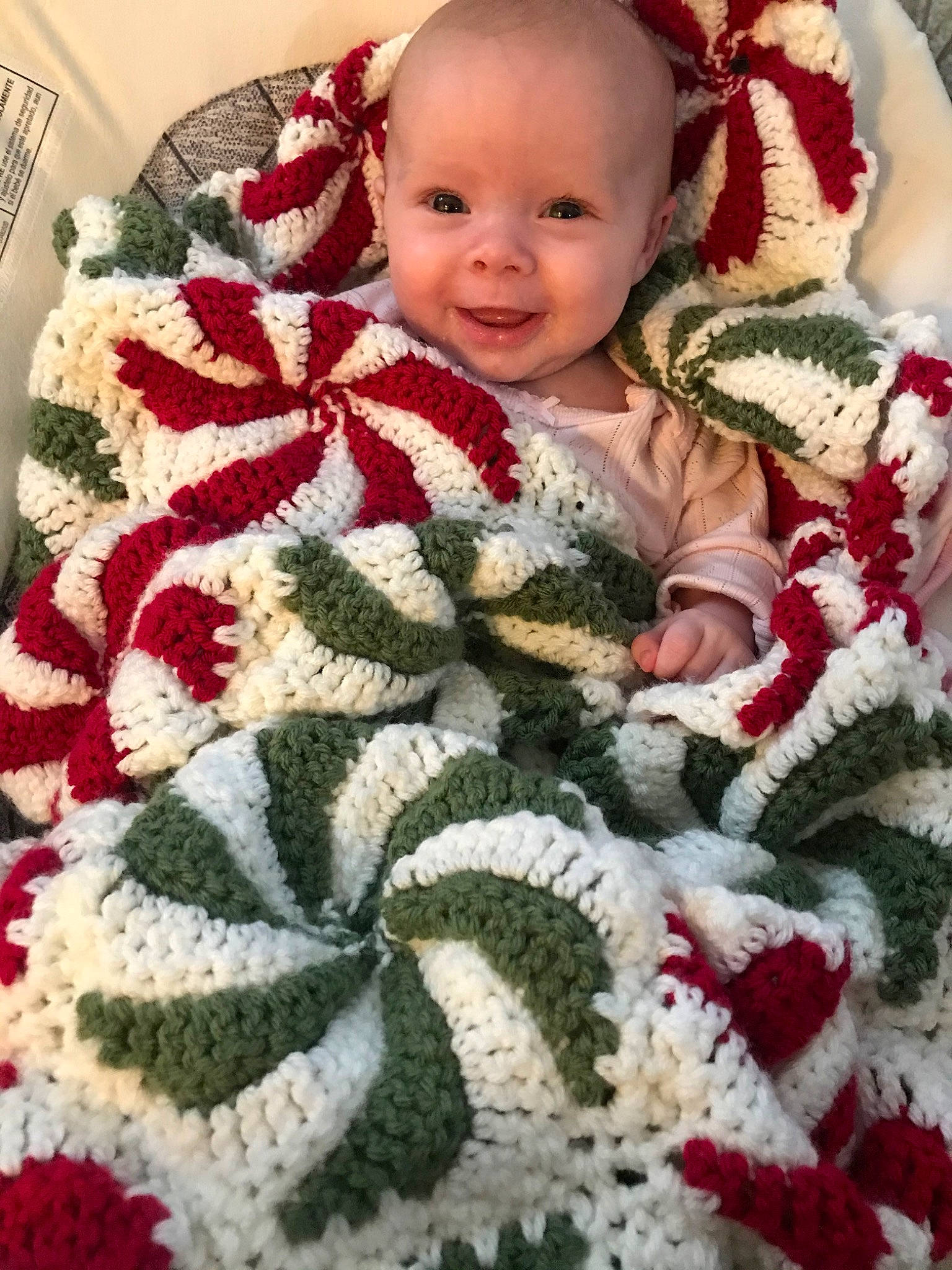 Haylin is registered to the contest to win money with this photo: art, baby, blanket, child, christmas, craft, crochet, interior_design, knitting, needlework, person, quilt, sweater, textile, toddler, wool, woolen