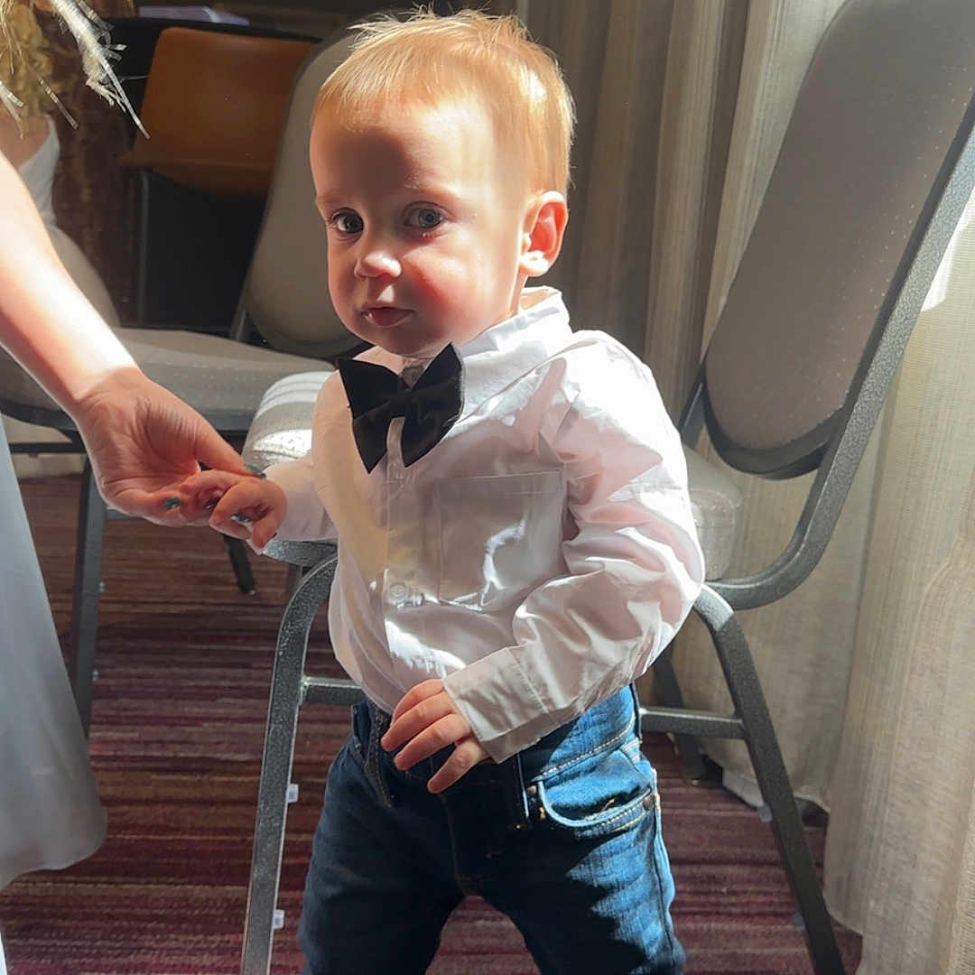 Ashton Tate joined the competition — help win amazing prizes! bow_tie, boy, brown_shoes, carpet, casual_clothing, chair, child, curtains, cute, hand_holding, indoor, jeans, light, person, portrait, shadow, small_child, standing, toddler, white_shirt