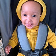 Ibrahim a rejoint le concours — aidez-le/la à gagner de superbes lots ! baby, bodypart, bonnet, cap, clothing, coat, face, finger, hand, happy, hat, head, hood, jacket, lifejacket, person, photography, portrait, smile, vest