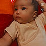 baby, infant, child, onesie, blanket, orange, red, face, expression, neon_effect, digital_overlay, devil_horns, heart, lying_down, cute, curious, skin, arm, head, indoors