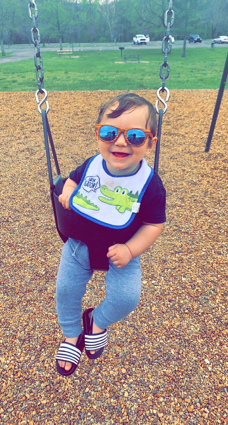 Brentley joined the competition — help win amazing prizes! baby_toddler_clothing, electric_blue, eyewear, face, fun, goggles, grass, happy, joy, leisure, outdoor_play_equipment, people_in_nature, person, playground, sleeve, smile, soil, sunglasses, swing, t_shirt