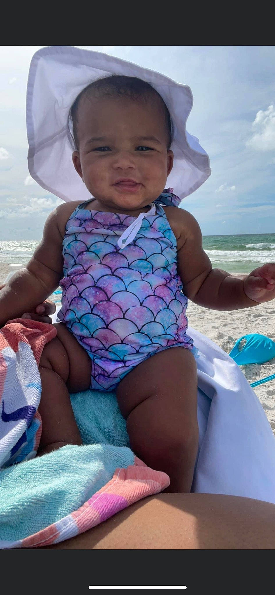 Tanyla is registered to the contest to win money with this photo: azure, baby_toddler_clothing, beach, blue, cloud, eye, face, facial_expression, happy, head, leg, mouth, muscle, organ, people_on_beach, person, photograph, pink, skin, sky
