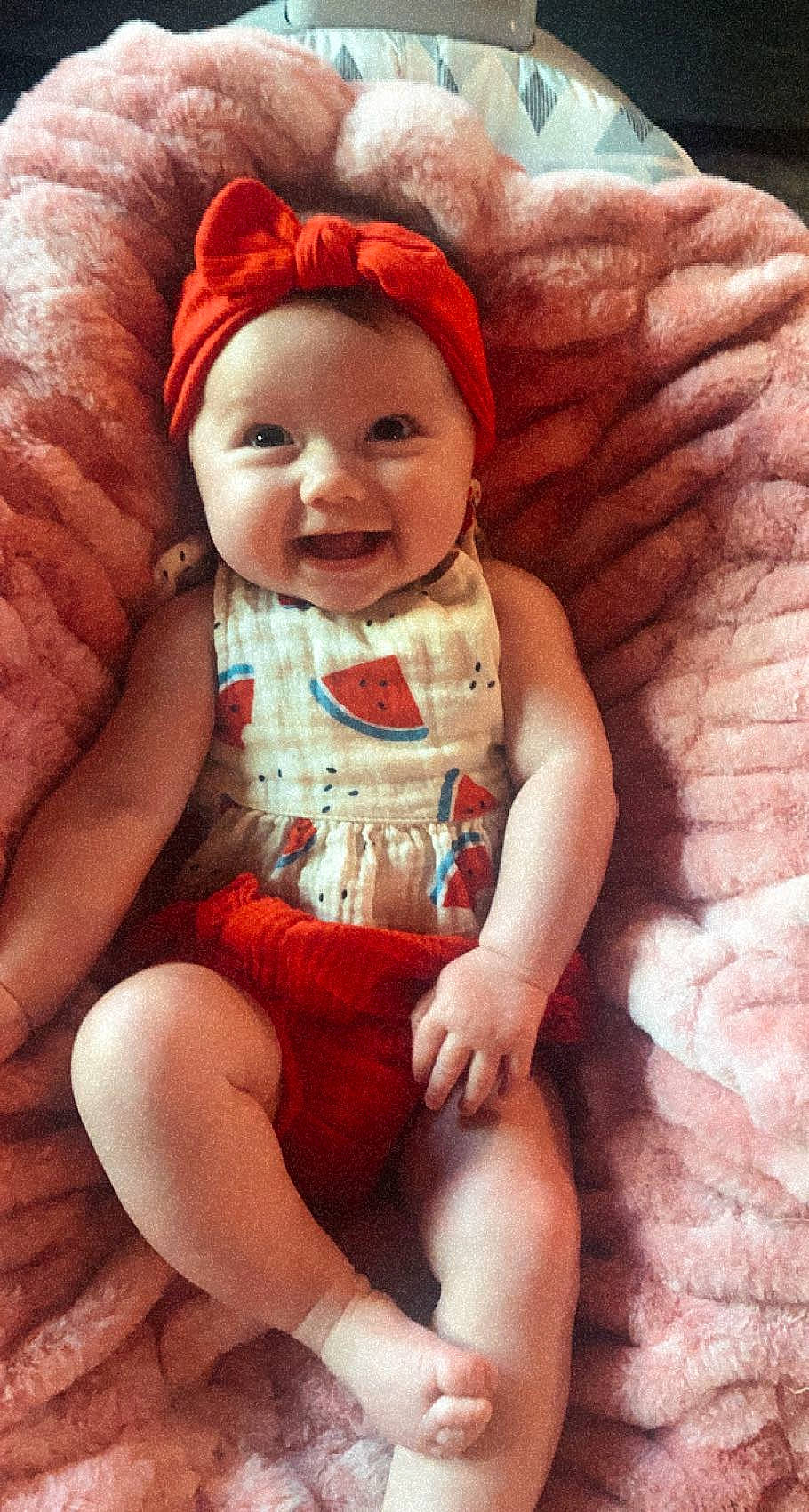 Andi joined the competition — help win amazing prizes! baby, baby_toddler_clothing, cap, comfort, eye, finger, happy, headwear, knee, lap, leg, lip, mouth, person, pink, skin, sleeve, smile, sun_hat, textile