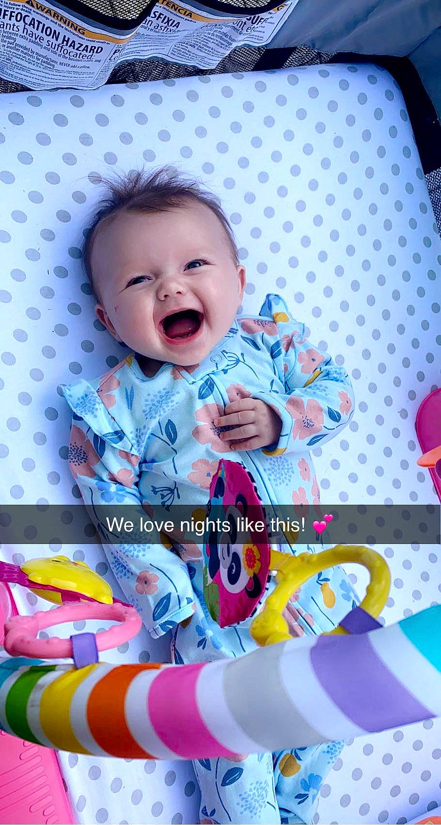 Andi is registered to the contest to win money with this photo: art, baby, baby_products, baby_toddler_clothing, cheek, child, design, fun, happy, linens, magenta, pattern, person, pink, play, sitting, sleeve, smile, textile, toddler