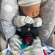 Walker joined the competition — help win amazing prizes! newborn, baby, infant, car_seat, blanket, mittens, hat, sleeping, cozy, stars, moon, pattern, child, cute, peaceful, soft, striped, colorful, fabric, indoors