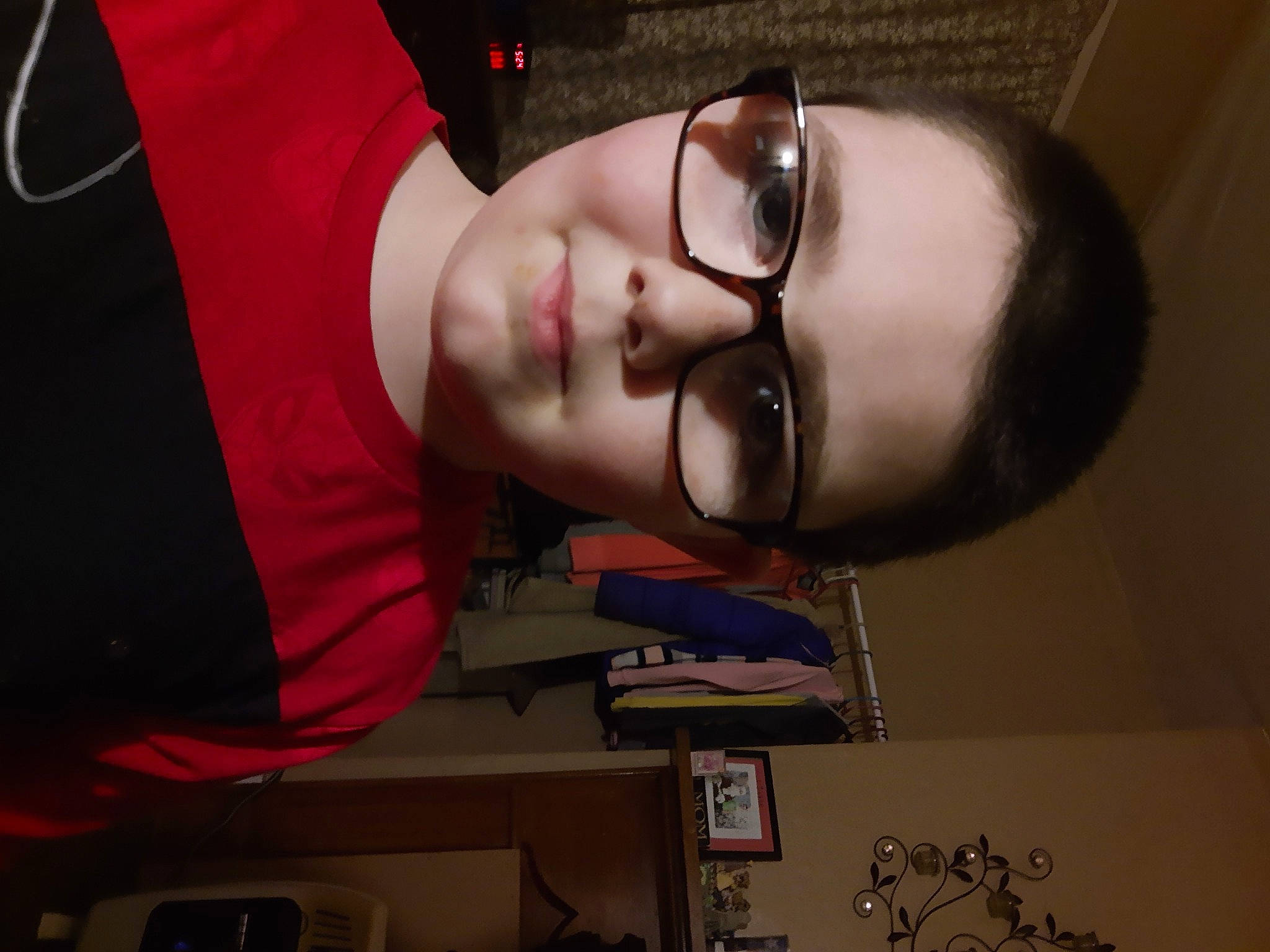 Johnathon is registered to the contest to win money with this photo: audio_equipment, black_hair, carmine, cheek, child, elbow, eyelash, eyewear, flesh, forehead, fun, glasses, headgear, jaw, mouth, nose, person, personal_protective_equipment, room, vision_care