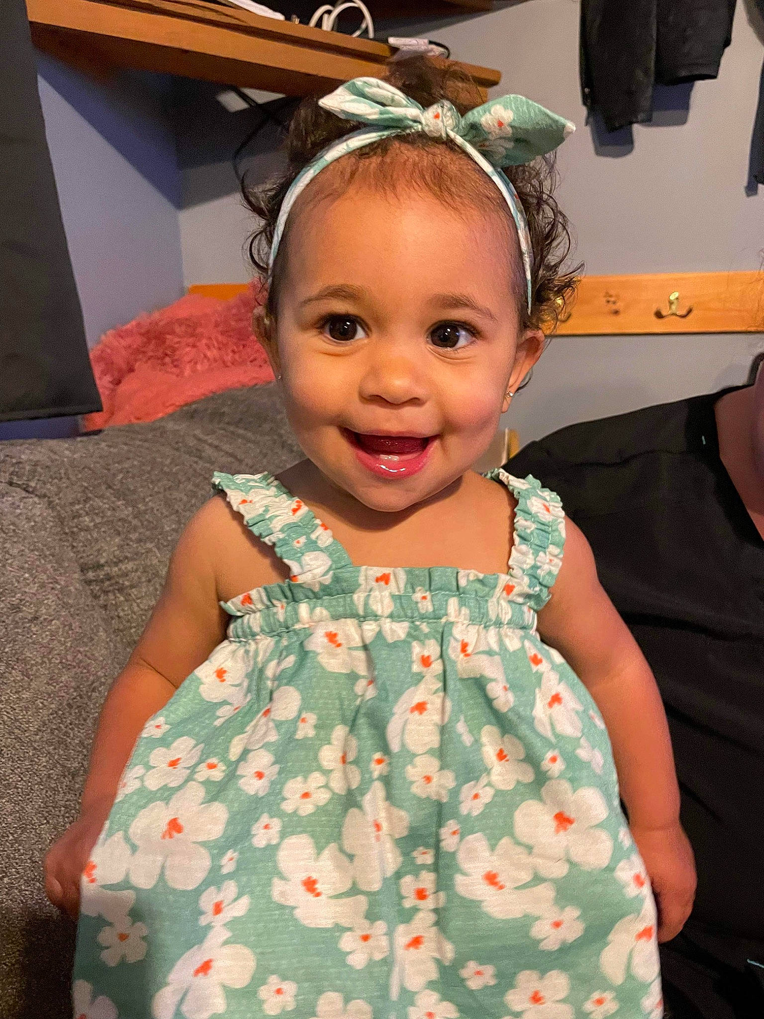 Xyla is registered to the contest to win money with this photo: baby_toddler_clothing, cheek, child, day_dress, design, event, fashion_accessory, fun, hairstyle, happy, headband, headpiece, pattern, peach, person, pink, room, skin, sleeve, smile