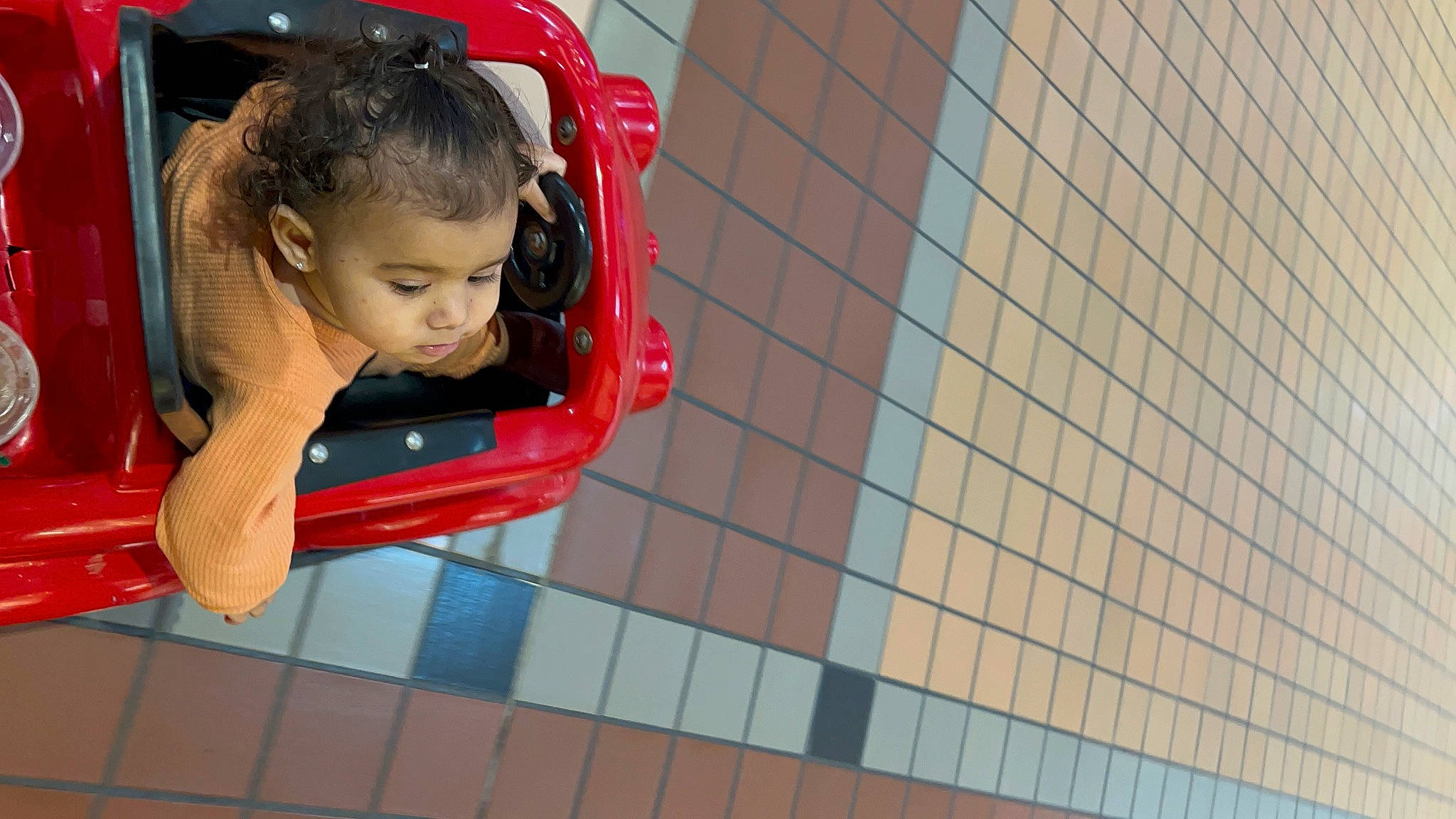 Ocean is registered to the contest to win money with this photo: baby, baby_products, brick, child, city, electric_blue, flooring, fun, happy, leisure, magenta, net, outdoor_play_equipment, pattern, person, play, playground, playground_slide, recreation, red