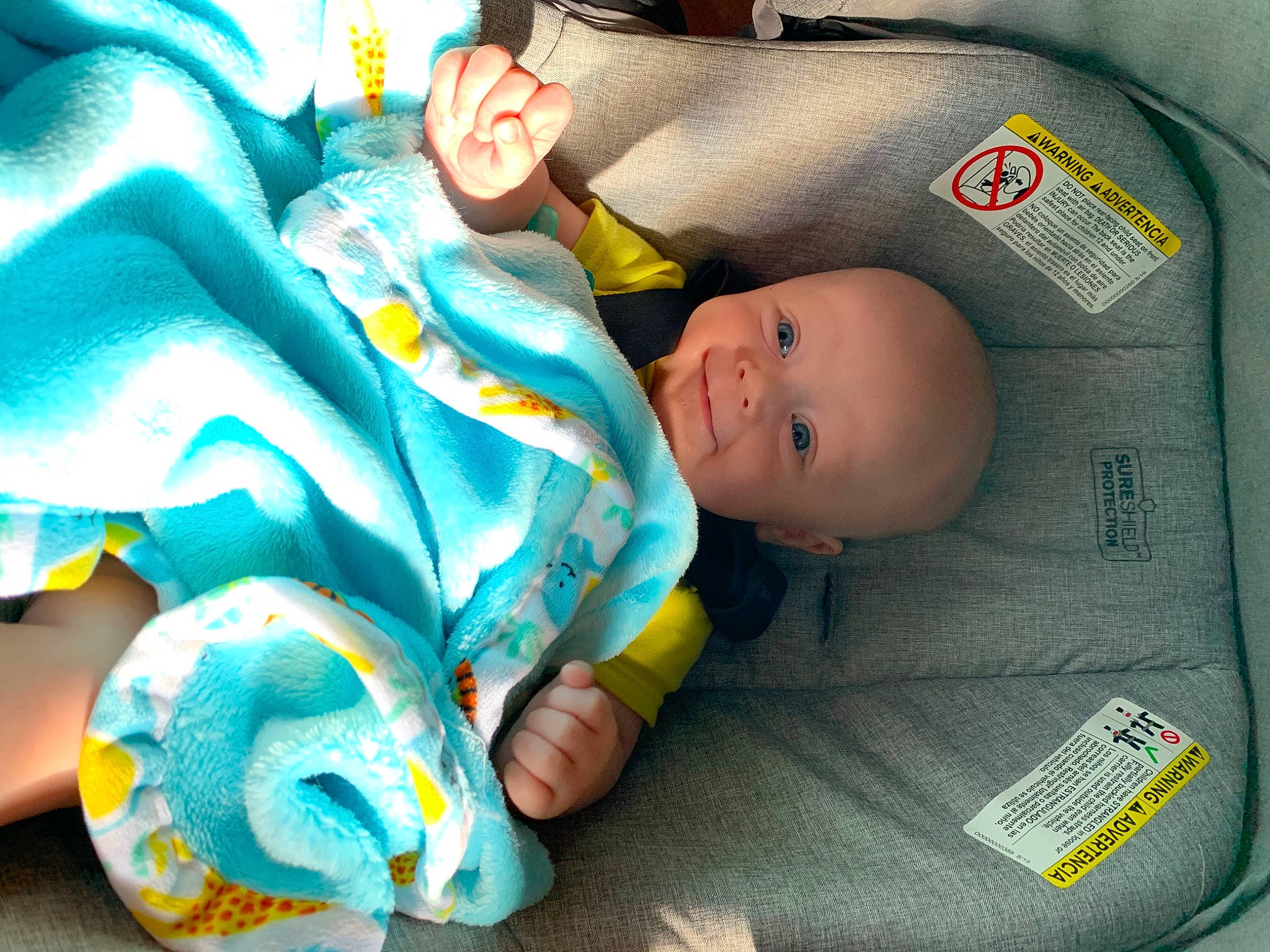 Colten is registered to the contest to win money with this photo: baby, baby_carriage, baby_products, baby_safety, baby_sleeping, baby_toddler_clothing, baby_toys, bedtime, car_seat, child, comfort, fun, green, linens, person, plastic, product, room, sitting, smile