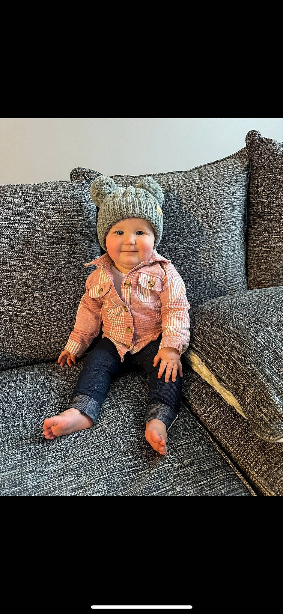 Teagan is registered to the contest to win money with this photo: baby, baby_toddler_clothing, cap, chair, child, comfort, couch, eye, fashion_accessory, flash_photography, flooring, fur, headwear, joy, linens, person, rectangle, sitting, sleeve, textile