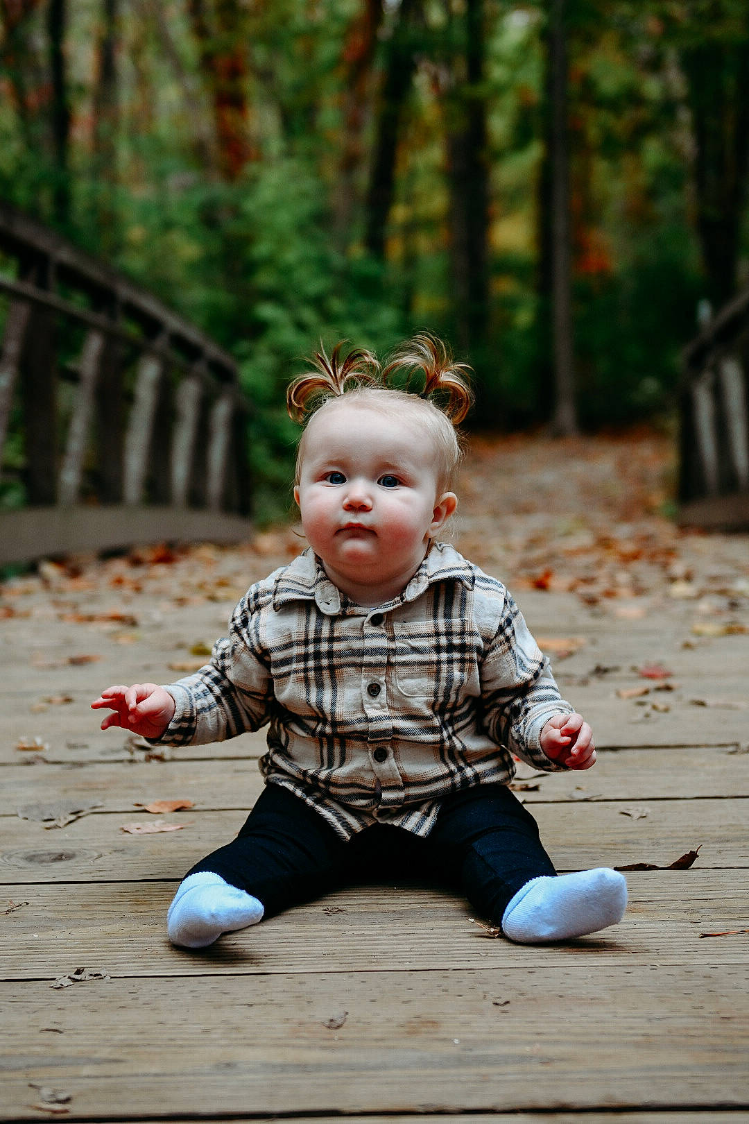 Teagan is registered to the contest to win money with this photo: baby, child, doll, dress, eye, flooring, forest, fun, grass, happy, head, leisure, pattern, people_in_nature, person, plant, sitting, toddler, toy, tree
