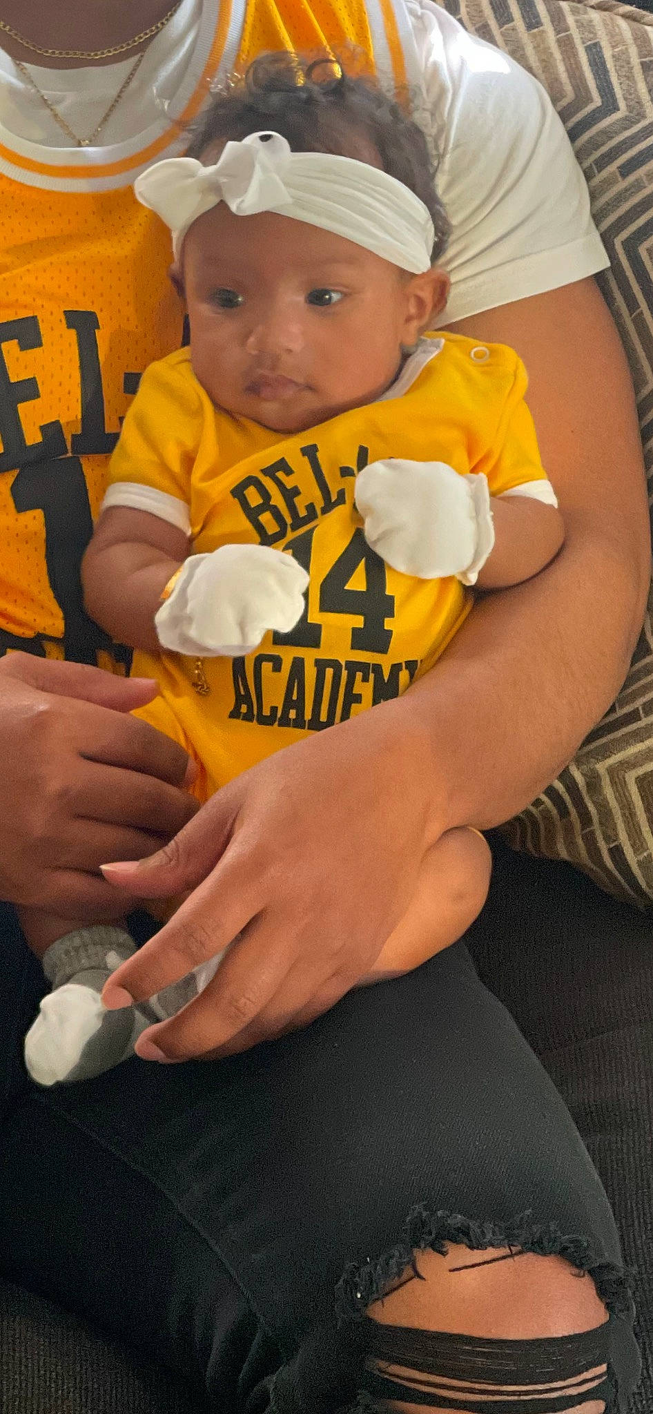 Jaide joined the competition — help win amazing prizes! baby, baby_toddler_clothing, baseball_cap, bib, cap, child, elbow, eye, finger, hand, happy, hat, headwear, human_leg, person, sitting, sleeve, t_shirt, thigh, thumb