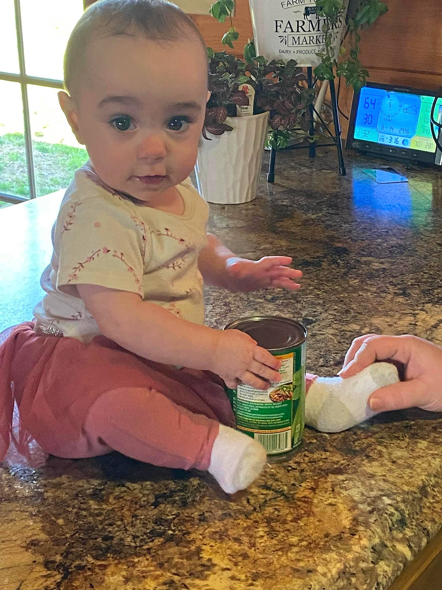 Alyssa is registered to the contest to win money with this photo: adaptation, baby, baby_toddler_clothing, child, flooring, foot, fun, happy, head, houseplant, lap, leisure, mammal, person, picture_frame, plant, play, sitting, skin, television