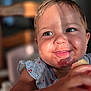 Romy participe au concours pour gagner de l'argent avec cette photo : child, toddler, smiling, messy_face, fruit, eating, sunlight, blue_dress, cherry_pattern, closeup, happy, portrait, baby, hand, skin, indoor, blurred_background, cute, cheeks, expression