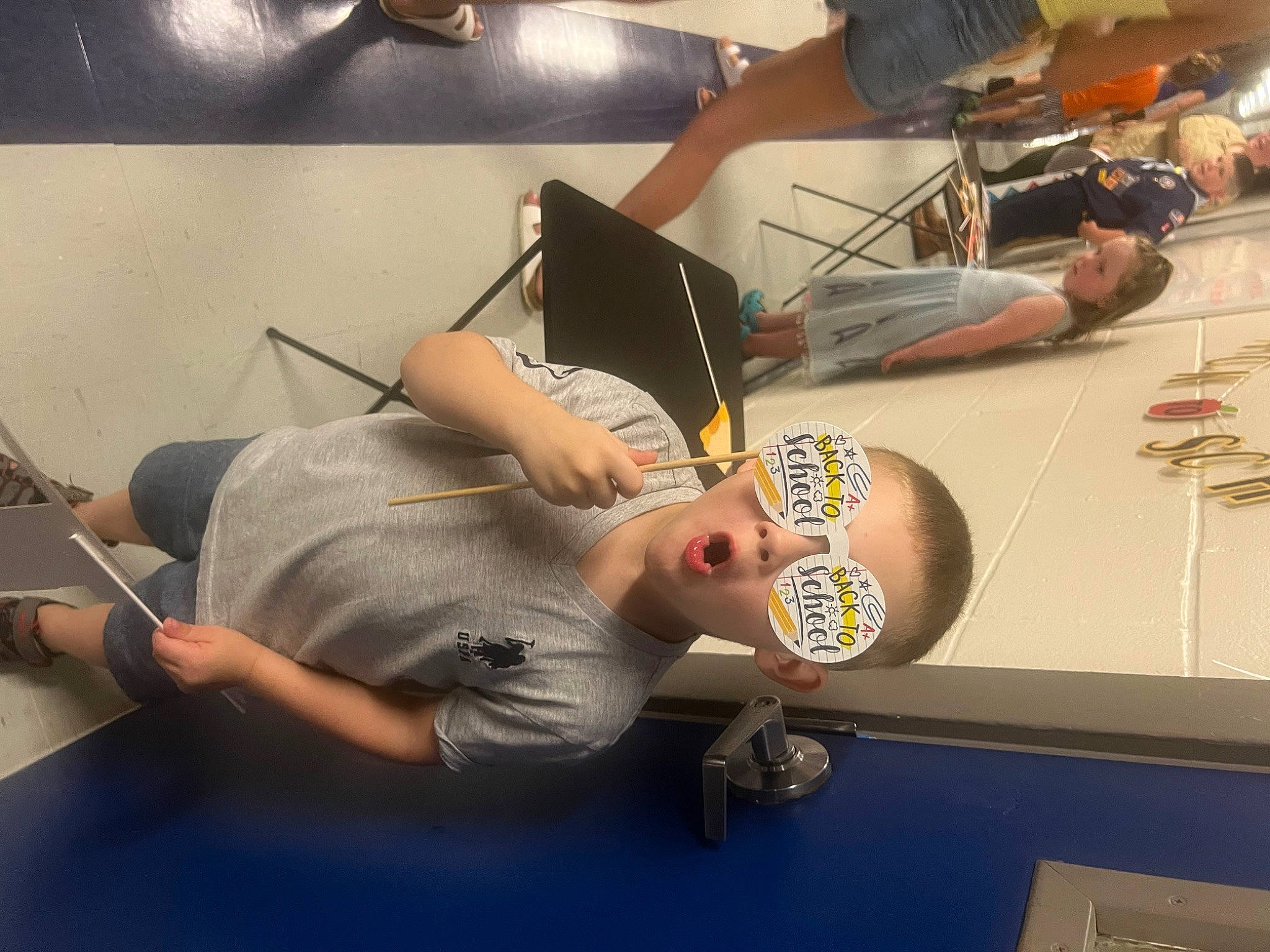 Declan is registered to the contest to win money with this photo: automotive_design, chair, comfort, elbow, eyewear, fast_food, flesh, fun, hat, human_leg, knee, metal, person, physical_fitness, room, sitting, t_shirt, tattoo, thigh