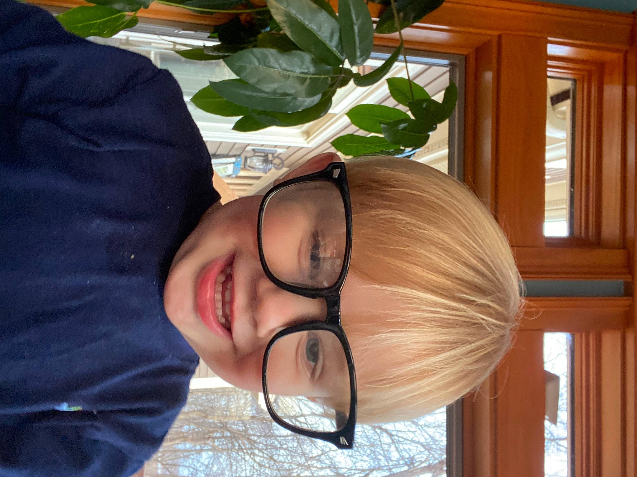 Donneghan is registered to the contest to win money with this photo: child, eyewear, fashion_accessory, fun, glasses, happy, joy, leisure, peach, person, plant, smile, sunglasses, tree, vision_care, wood