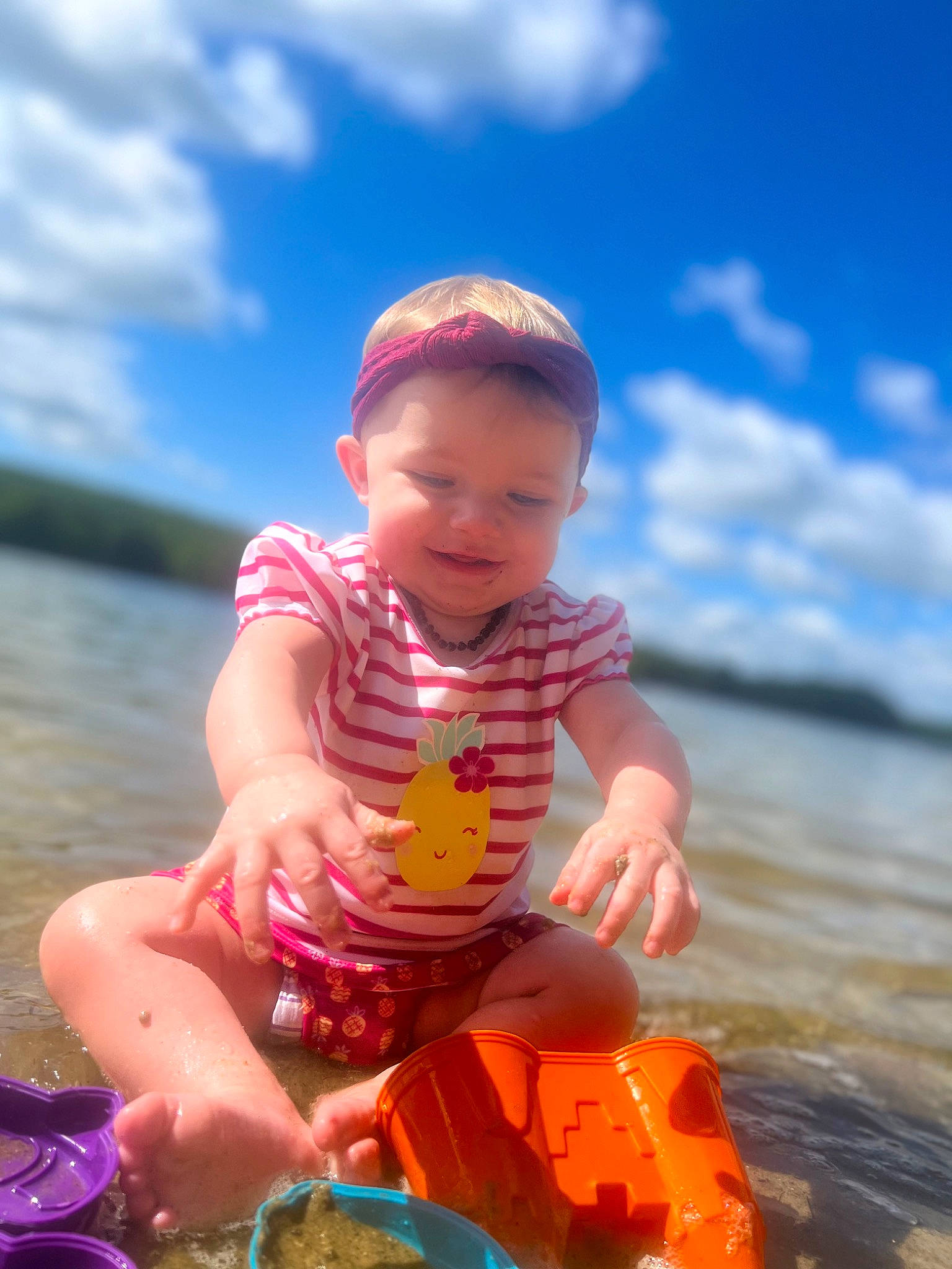 Maisy joined the competition — help win amazing prizes! baby, baby_toddler_clothing, child, cloud, fun, happy, lake, leisure, lifejacket, ocean, people_in_nature, person, personal_protective_equipment, recreation, sitting, sky, smile, summer, toddler, vacation