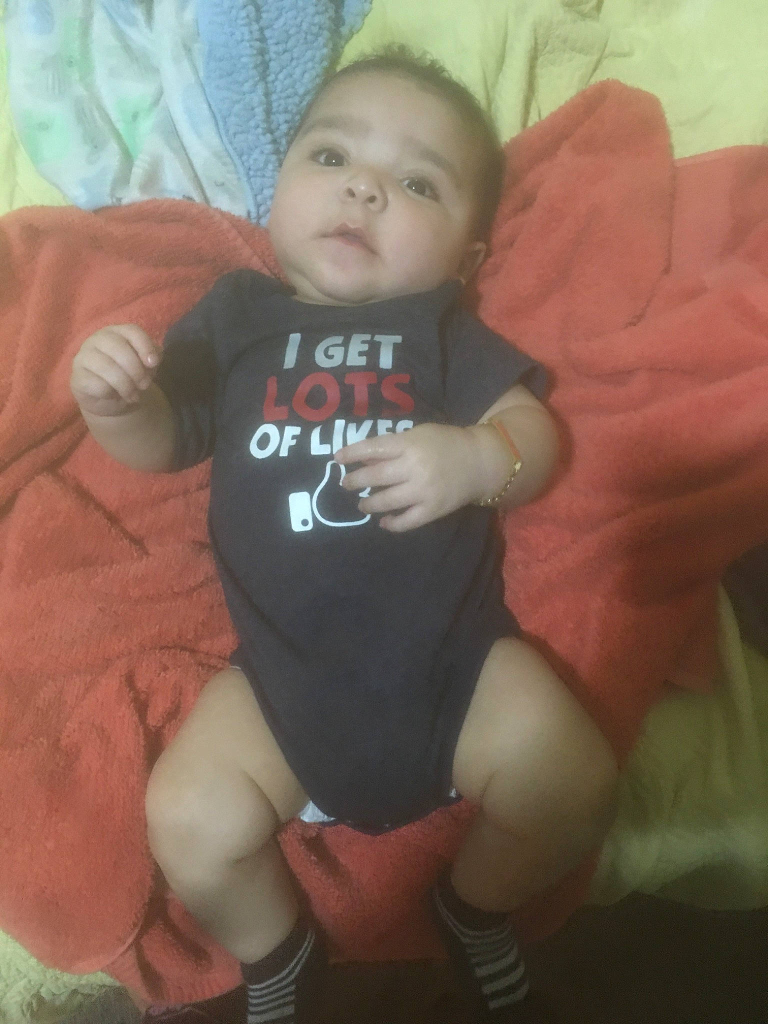 Uriel is registered to the contest to win money with this photo: arm, baby, cheek, child, face, finger, head, leg, muscle, person, sitting, skin, smile, thumb, toddler