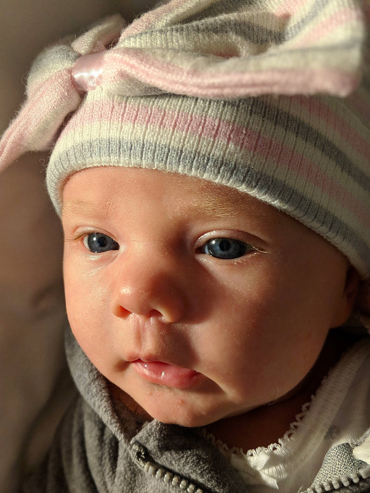 Leighton is registered to the contest to win money with this photo: bonnet, cap, cheek, child, close_up, eye, eyebrow, face, forehead, girl, head, headgear, infant, knit_cap, lip, nose, person, portrait_photography, skin, toddler
