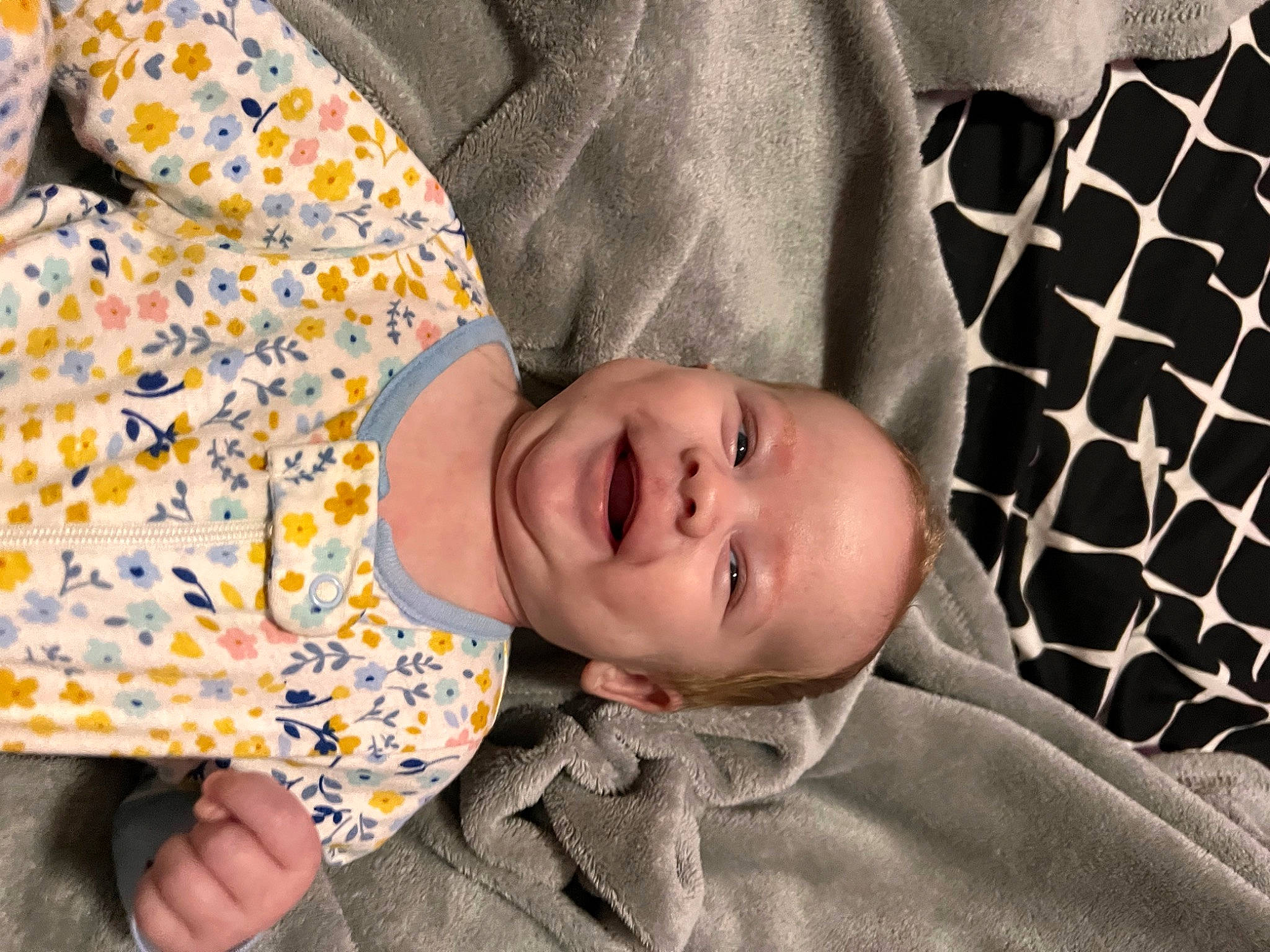 Amara is registered to the contest to win money with this photo: baby, baby_toddler_clothing, child, comfort, finger, happy, linens, pattern, person, portrait_photography, sitting, skin, sleep, sleeve, smile, textile, toddler, tree, wood