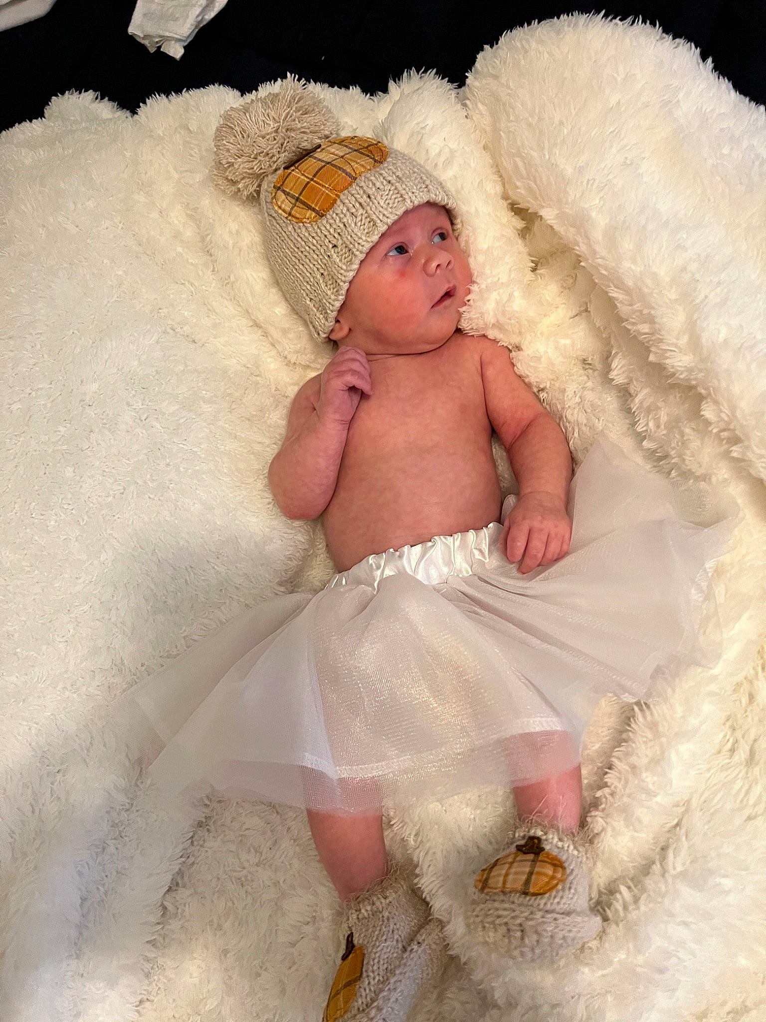 Amara is registered to the contest to win money with this photo: arm, art, baby, baby_sleeping, baby_toddler_clothing, child, comfort, embellishment, fashion_accessory, fur, hand, head, headgear, headwear, human_body, linens, peach, person, pink, sitting