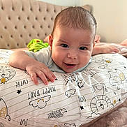 Nikolas joined the competition — help win amazing prizes! animal_drawing, baby, bedroom, blanket, child, comfort, cute, face, hand, happy, headboard, indoors, infant, pattern, person, pillow, portrait, smiling, soft_texture, young
