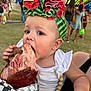 toddler, child, food, ham, headband, watermelon_pattern, outdoor, festival, people, grass, summer, fair, carnival, appetite, cute, earring, white_clothing, beads, holding, portrait