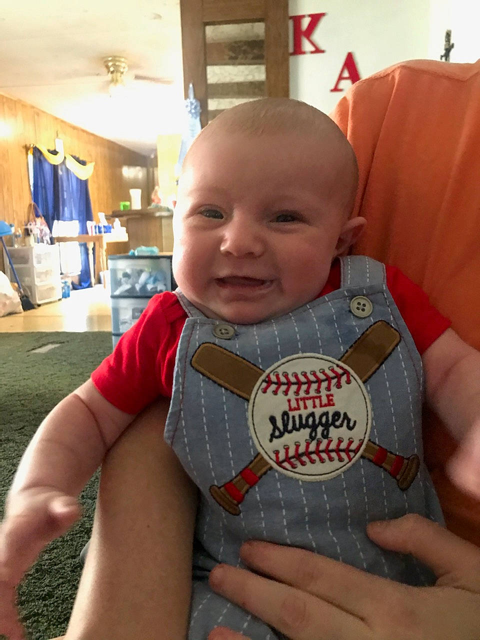 Kamden is registered to the contest to win money with this photo: baby, baby_toddler_clothing, cheek, child, chin, face, facial_expression, finger, flooring, hairstyle, hand, happy, head, joint, person, skin, sleeve, smile, t_shirt, thumb