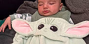 Joseph joined the competition — help win amazing prizes! baby, blanket, child, comfort, couch, cozy, cushion, cute, face, green, indoors, person, pink, plush, relaxation, rest, sleeping, soft_texture, wrapped, young_child