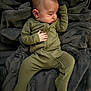 baby, blanket, child, comfort, cozy, cute, footed_pajamas, green_clothing, head, indoor, infant, onesie, peaceful, plush, portrait, relaxation, resting, sleeping, small_hands, soft_texture